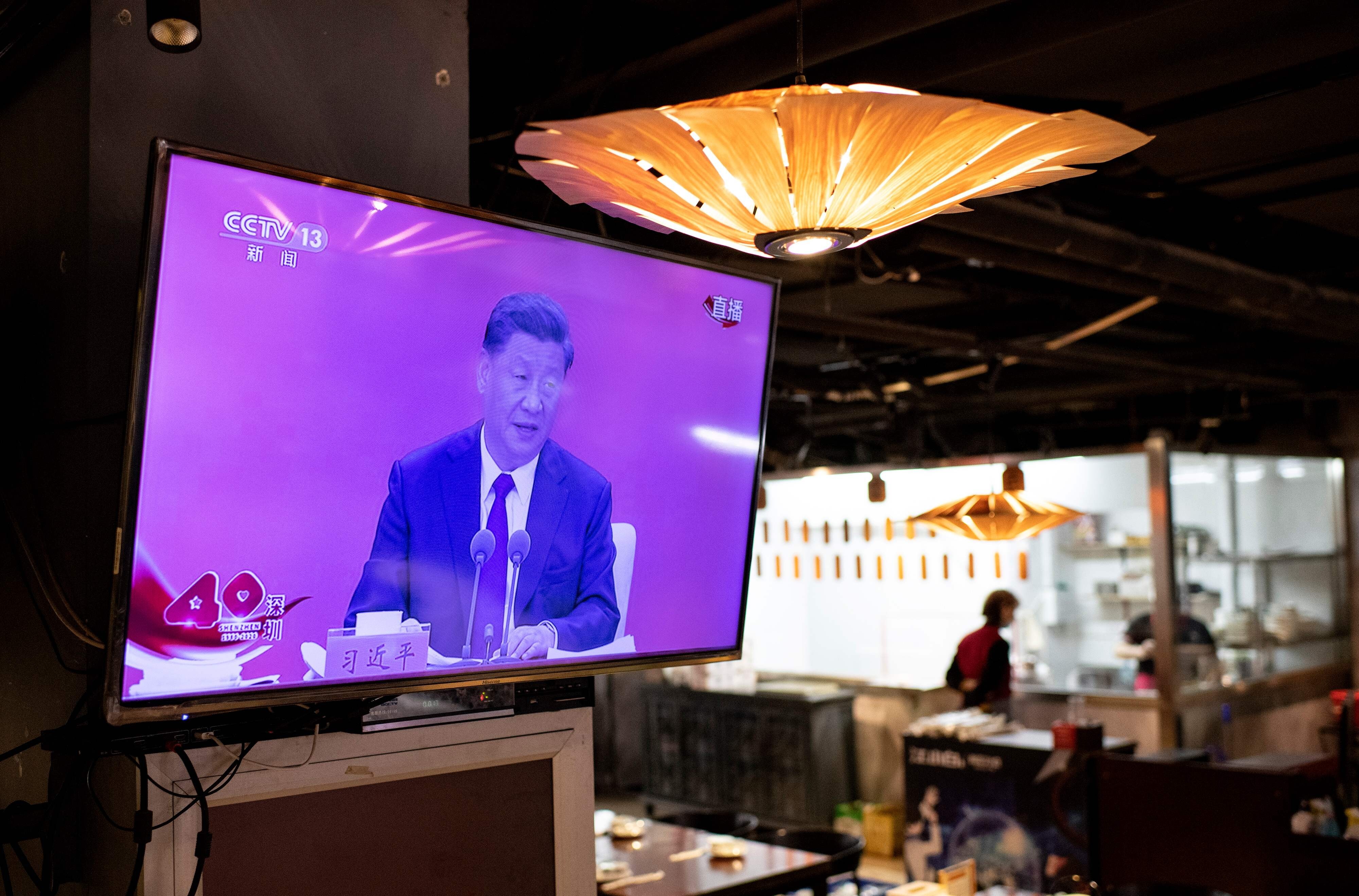 A broadcast of President Xi Jinping’s speech is shown on a television at a Beijing restaurant on Wednesday. Photo: AFP