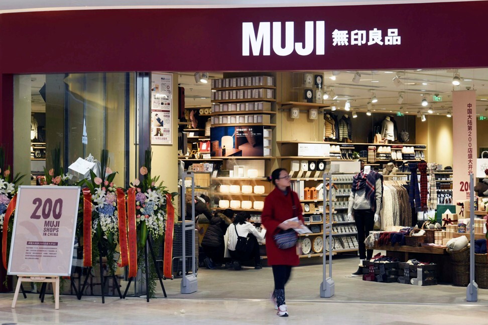 A shopper walks outside a newly opened Muji store at a shopping mall in Hangzhou in eastern Zhejiang province in late 2016. Photo: Reuters