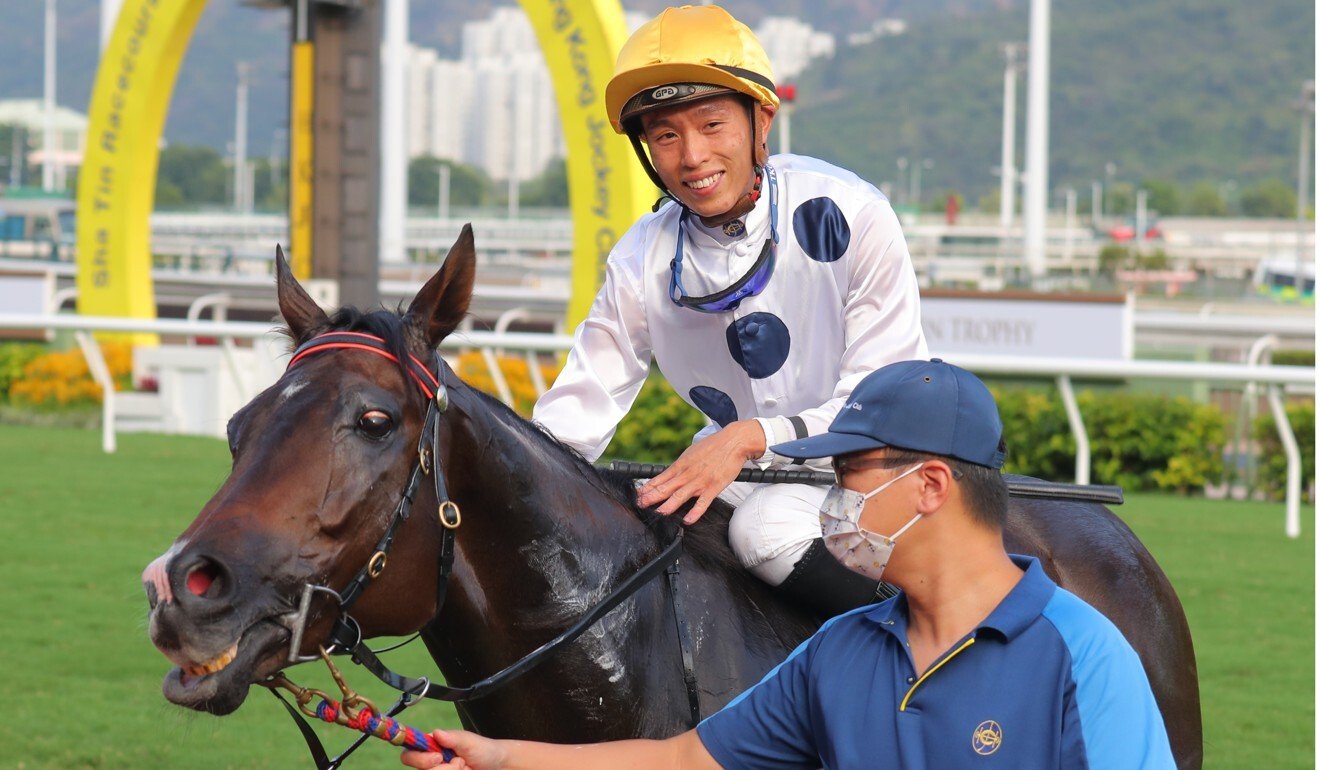 Vincent Ho is all smiles as he heads to the winner’s circle aboard Golden Sixty.