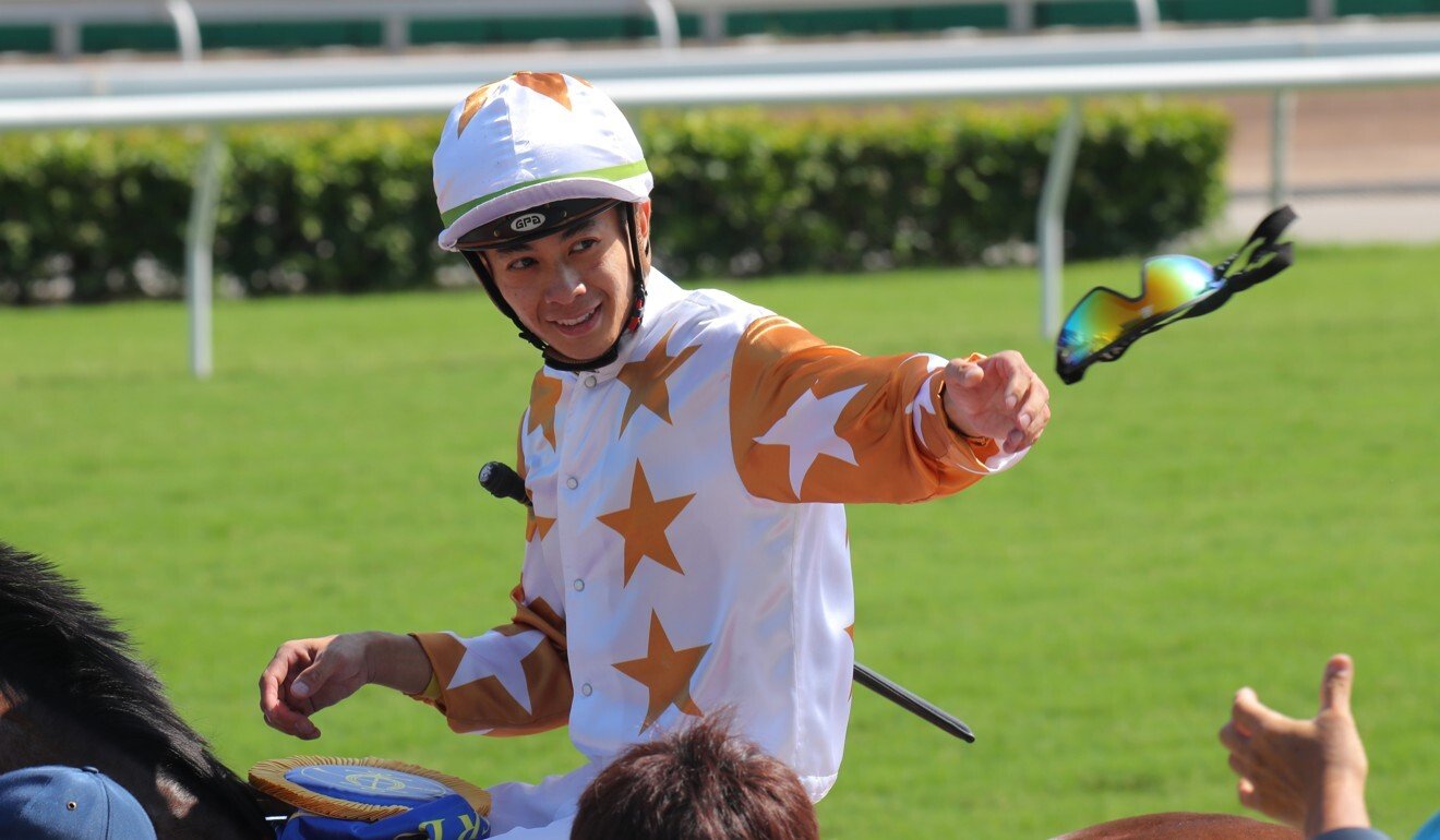 Derek Leung celebrates his win on Wishful Thinker by throwing his goggles to the crowd.