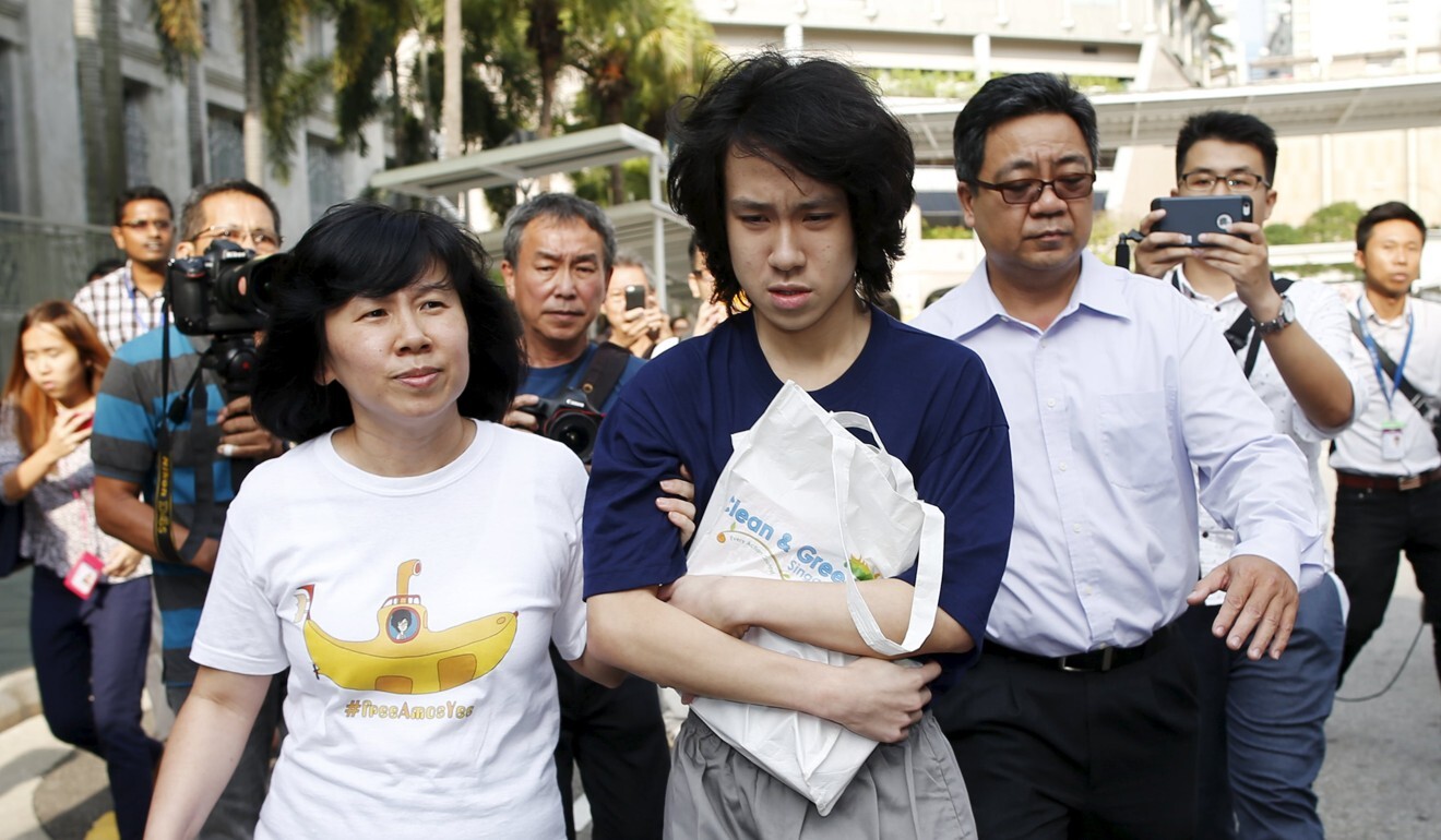 Amos Yee leaves with his parents after his sentencing in Singapore in July 2015. Photo: Reuters
