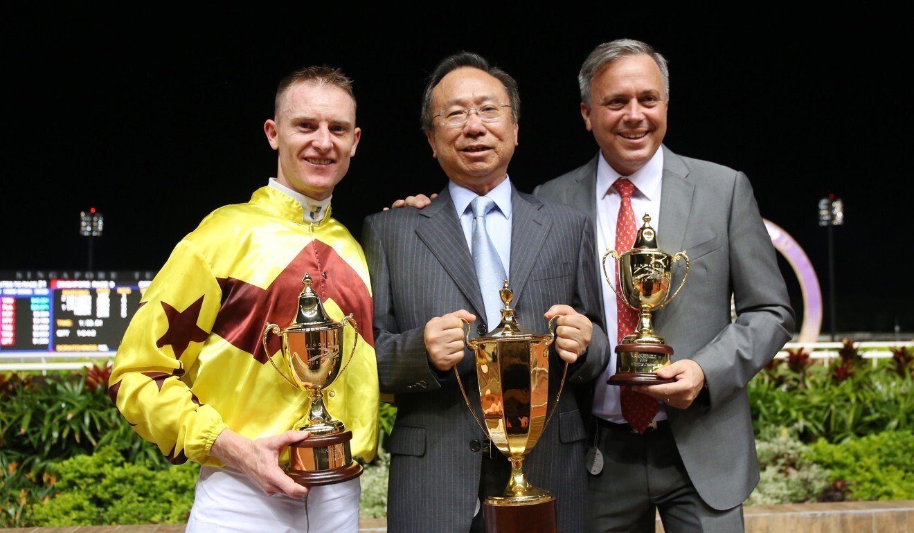 Caspar Fownes with jockey Zac Purton and owner Boniface Ho after Southern Legend’s win in the 2019 Kranji Mile.