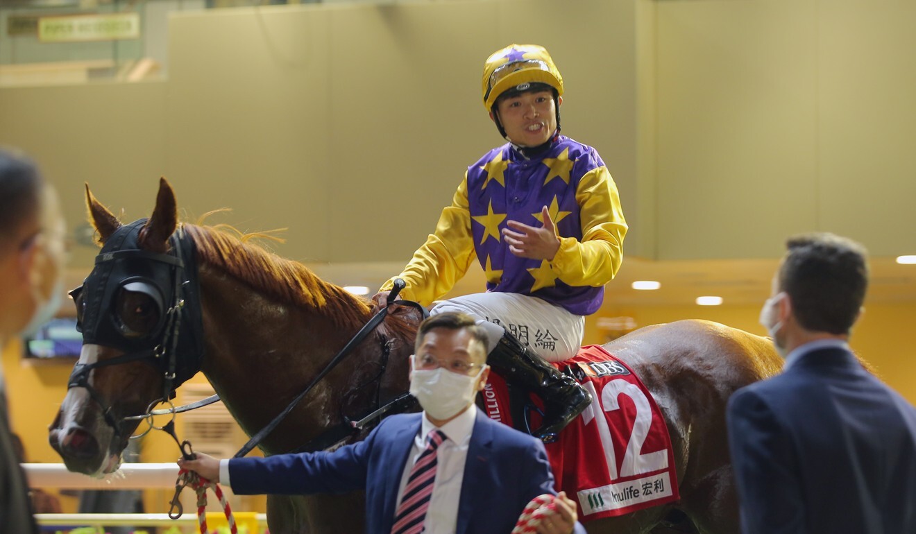 Jockey Keith Yeung aboard Amazing Kiwi after their win.