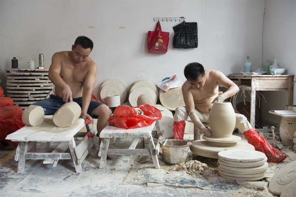 Artisans at Xiong’s factory cut and shape the clay. “It’s a precise process only a few can master,” Xiong says. Some workers specialise in making large vases while others produce cups. “The weight has to be precise,” says Feng Donghai, who has been working in the industry for 24 years and is currently employed by porcelain company Zhen Rutang. He uses a razor to smooth the surface of the piece he is working on so that it resembles “baby skin”. He takes about 30 seconds to make each piece and the scales always show the same result: 60 grams. Although Feng complains that his skills are underappreciated, others consider the job to be well paid. “They may earn only five yuan per cup, but an experienced artisan may shape 1,000 a day,” says Ran Xiangfei, founder of tableware brand Royoko. Photo: Zigor Aldama