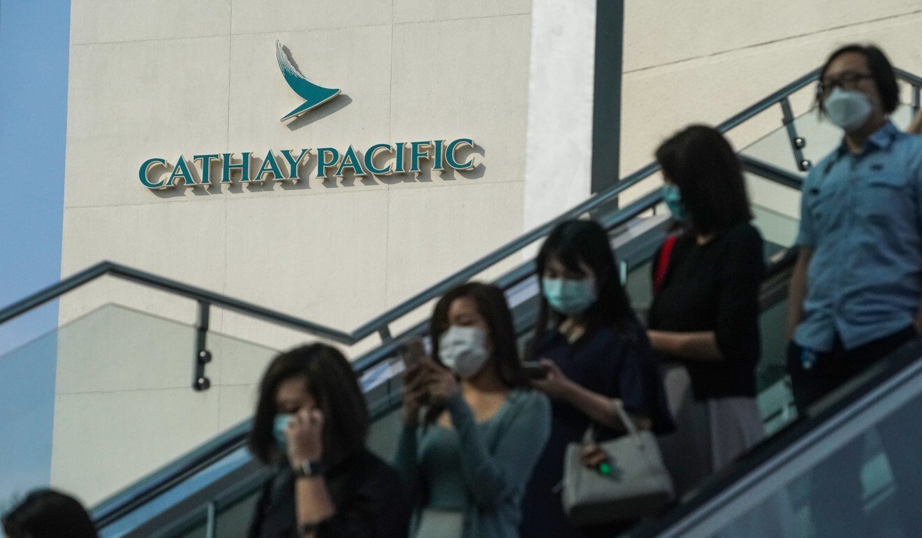 Cathay Pacific Airways employees leave the company’s headquarters on Wednesday. Photo: Felix Wong