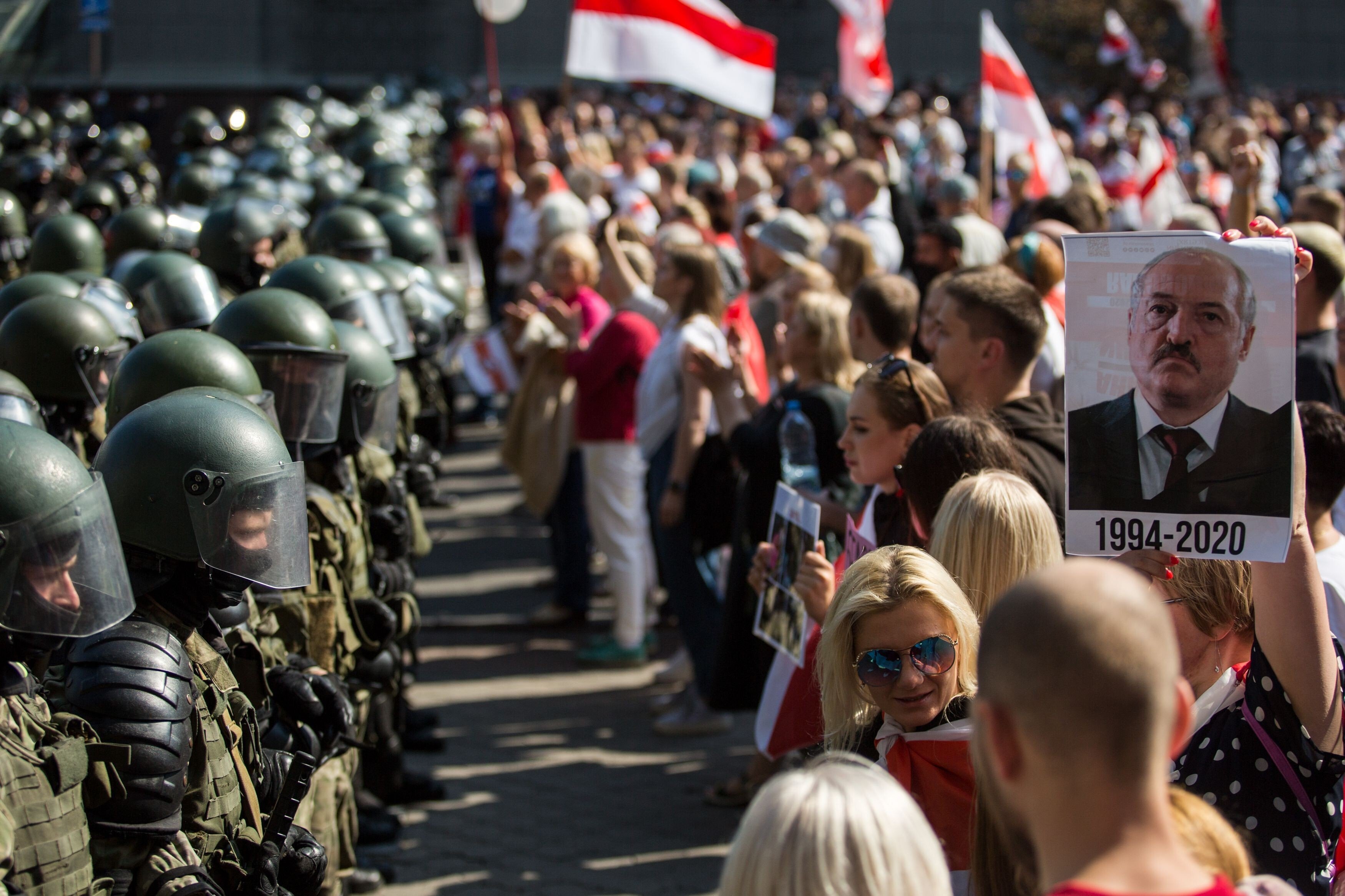 Belarusian servicemen block a street in Minsk on August 30 during a rally by opposition supporters protesting against disputed presidential election results. Tens of thousands of opposition supporters marched through the city calling for an end to strongman Alexander Lukashenko’s rule. Photo: TUT.BY/ AFP