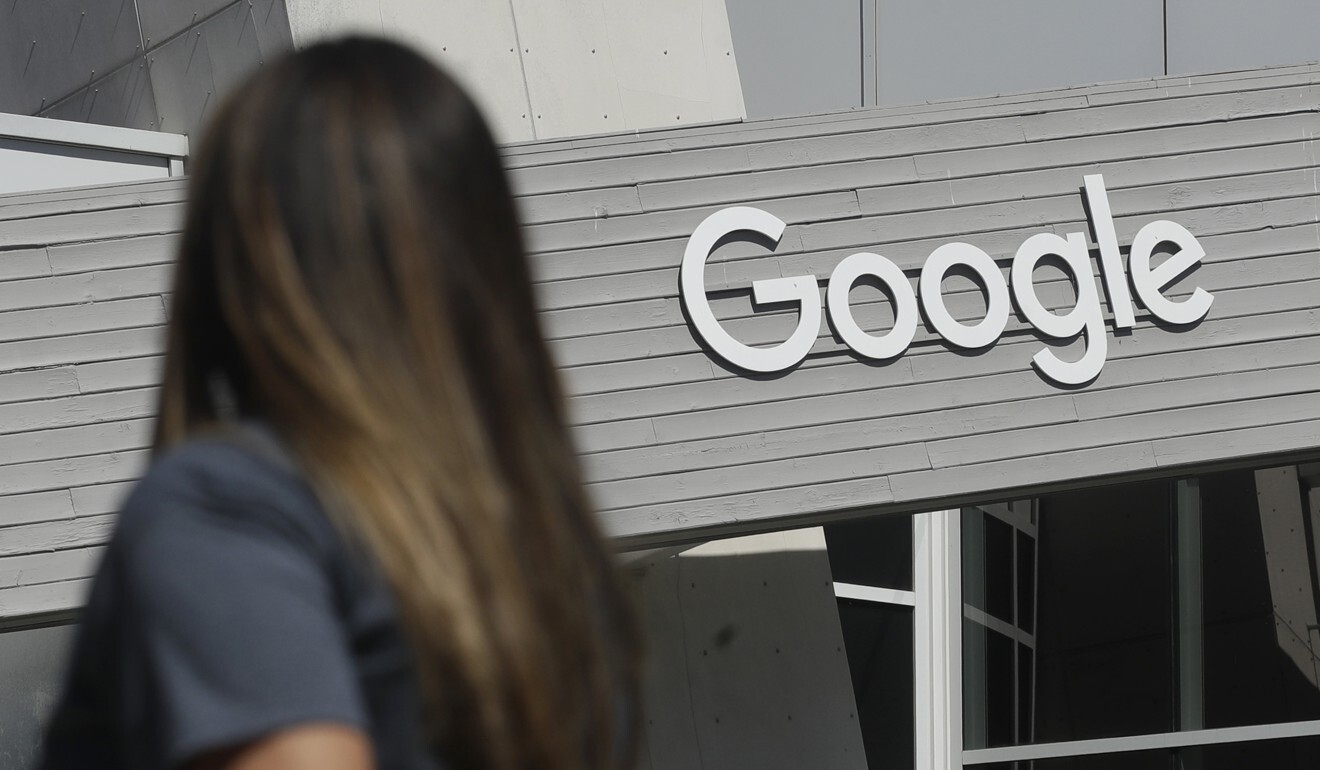 A woman walks below a Google sign on the company’s campus in Mountain View, California, in September 2019. Photo: AP