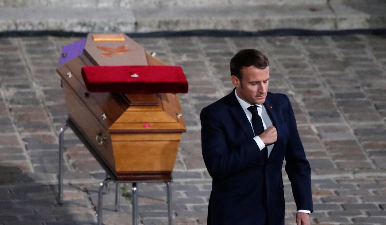 French President Emmanuel Macron pays his respects by the coffin of slain teacher Samuel Paty in Sorbonne University’s courtyard in Paris. Photo: AFP