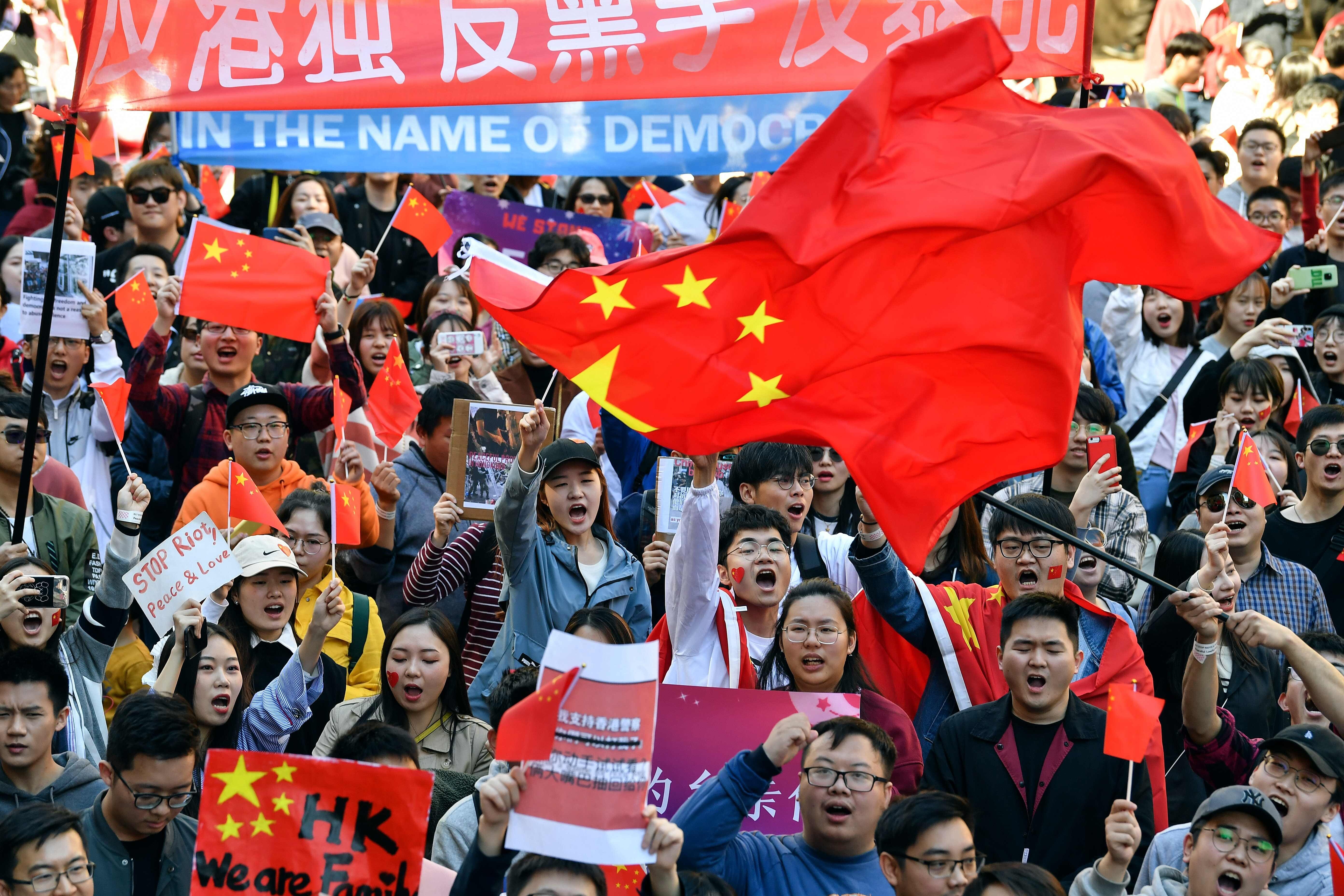 Pro-China activists march through the streets of Sydney on August 17, 2019, as they rally against anti-government protests in Hong Kong. Photo: AFP