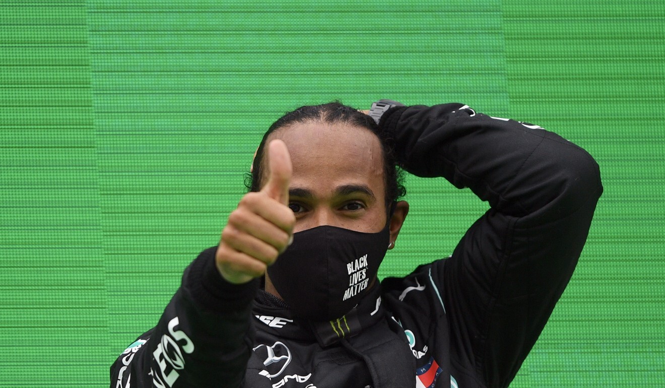 Mercedes driver Lewis Hamilton of Britain celebrates after winning the Formula One Portuguese Grand Prix at the Algarve International Circuit in Portimao on Sunday. Photo: AP