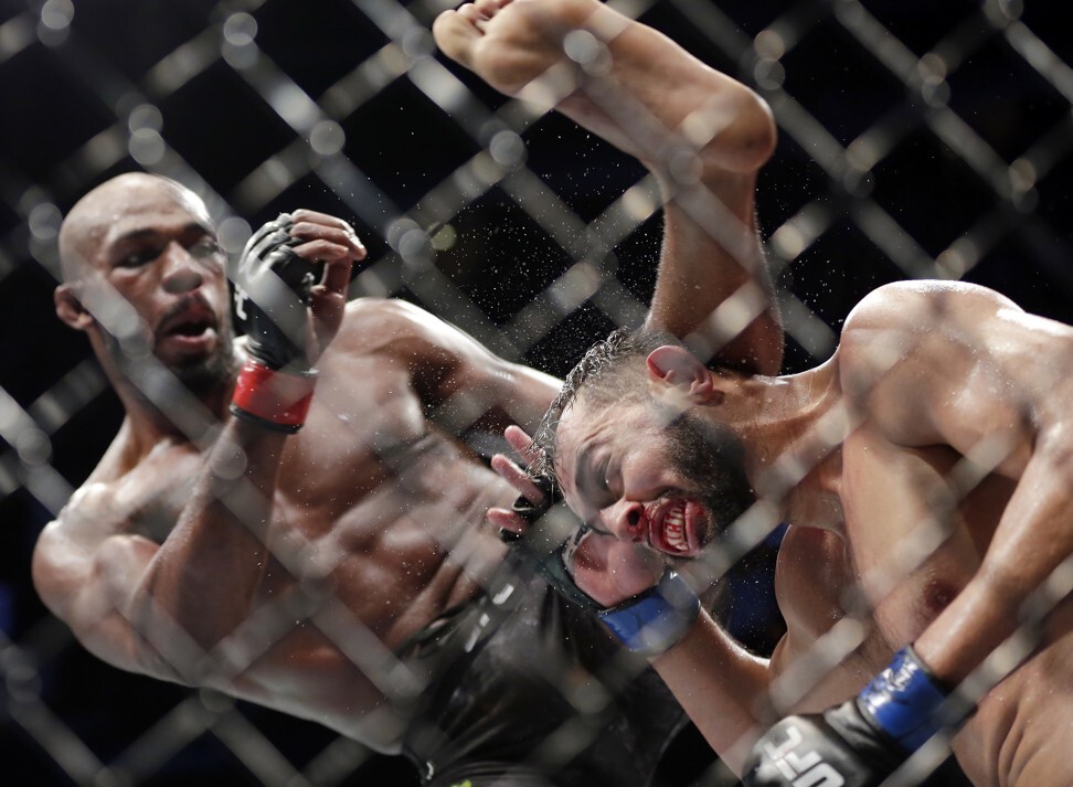Jon Jones delivers a kick to Dominick Reyes during their light heavyweight title bout at UFC 247. Photo: AP