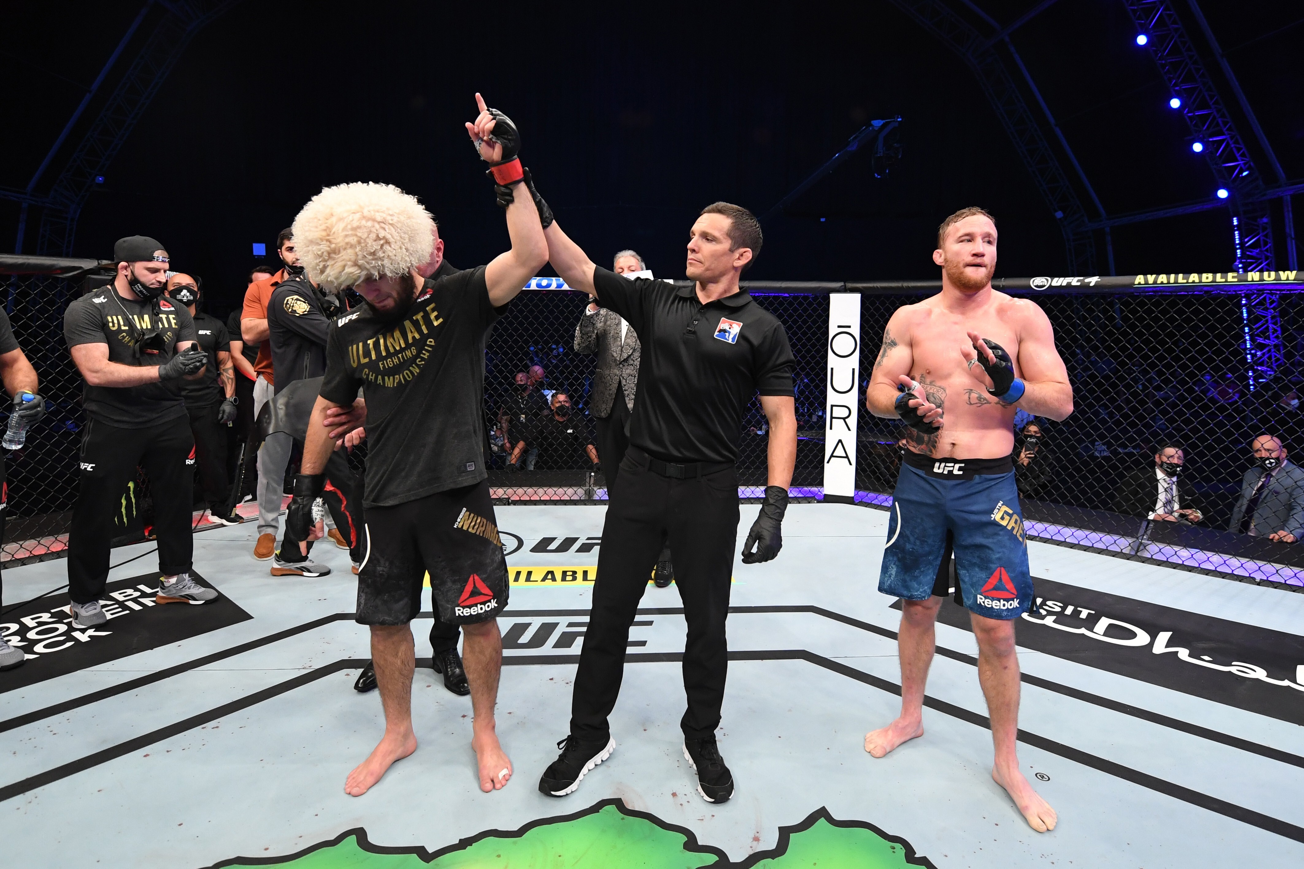 Khabib Nurmagomedov celebrates his victory over Justin Gaethje in their lightweight title bout at the UFC 254 on Fight Island in Abu Dhabi. Photos: Josh Hedges/Zuffa LLC via Getty Images