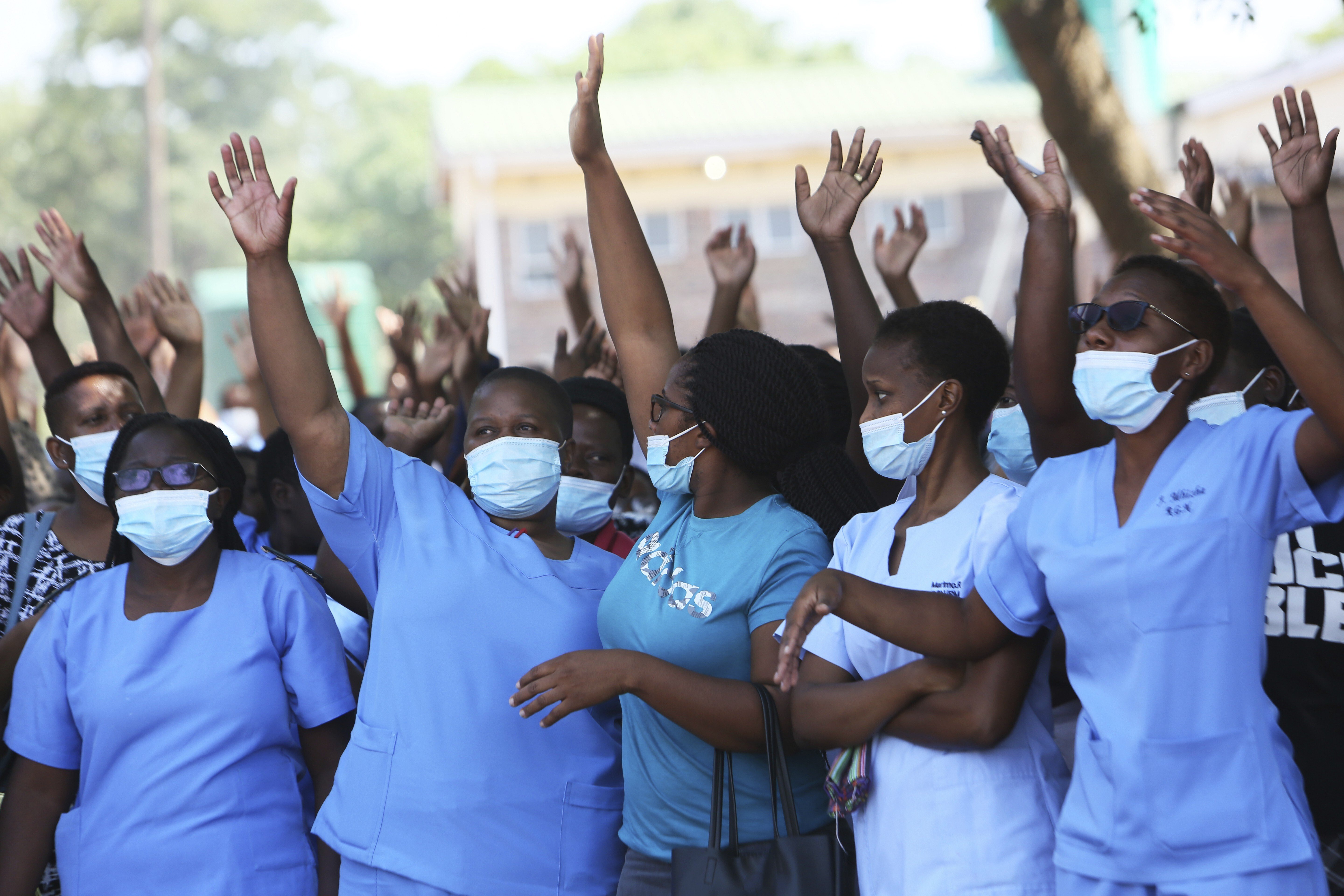 Zimbabwe nurses supporting a boycott at one of the country’s biggest public hospitals in Harare on Monday, after the health ministry scrapped a flexible working-hours system. Pandemic-related restrictions have added to the strains the country has felt under sanctions in place for almost two decades. Photo: AP