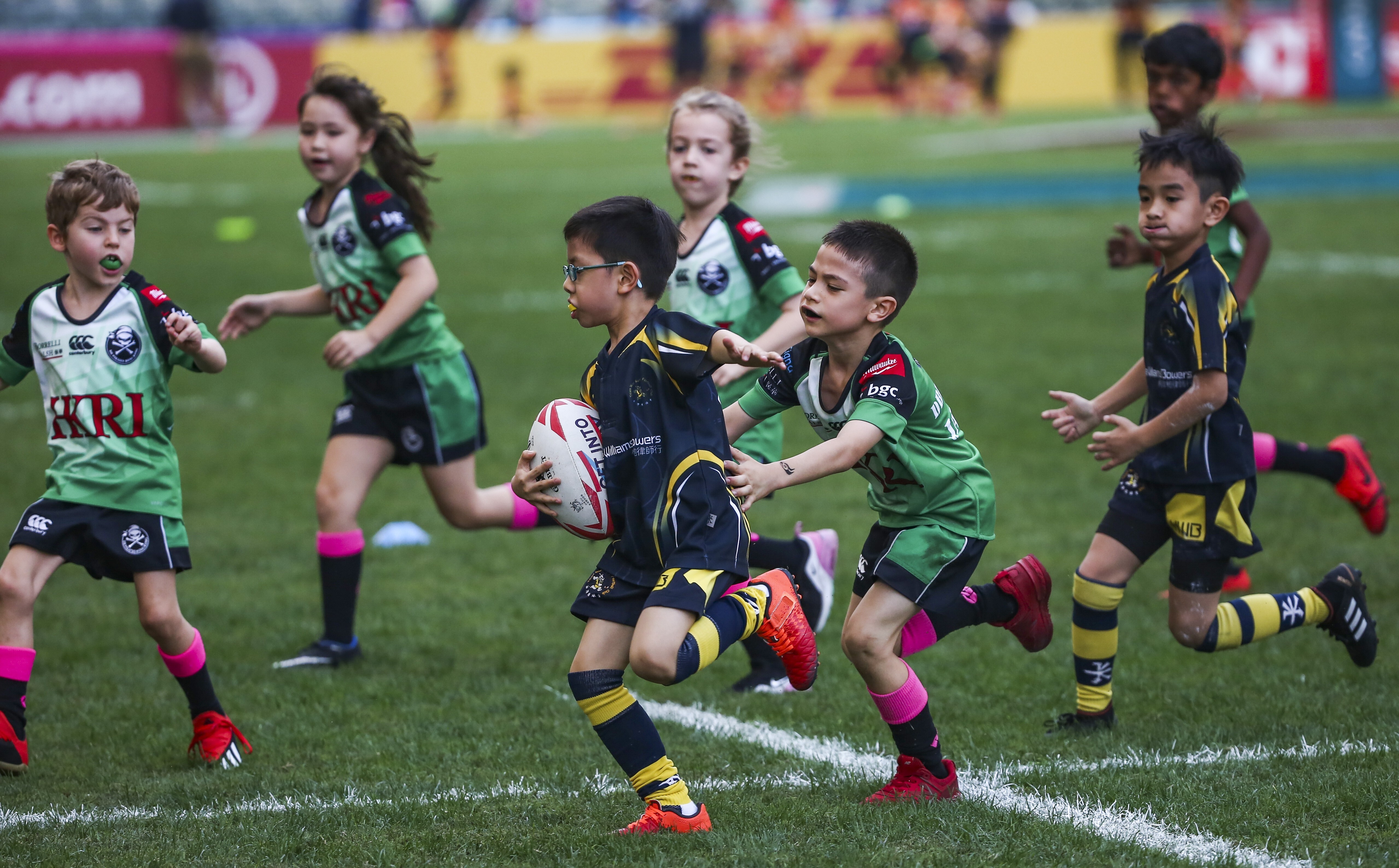 Boys and girls play together in a mini rugby game at the Hong Kong Sevens in 2019. Photo: Jonathan Wong