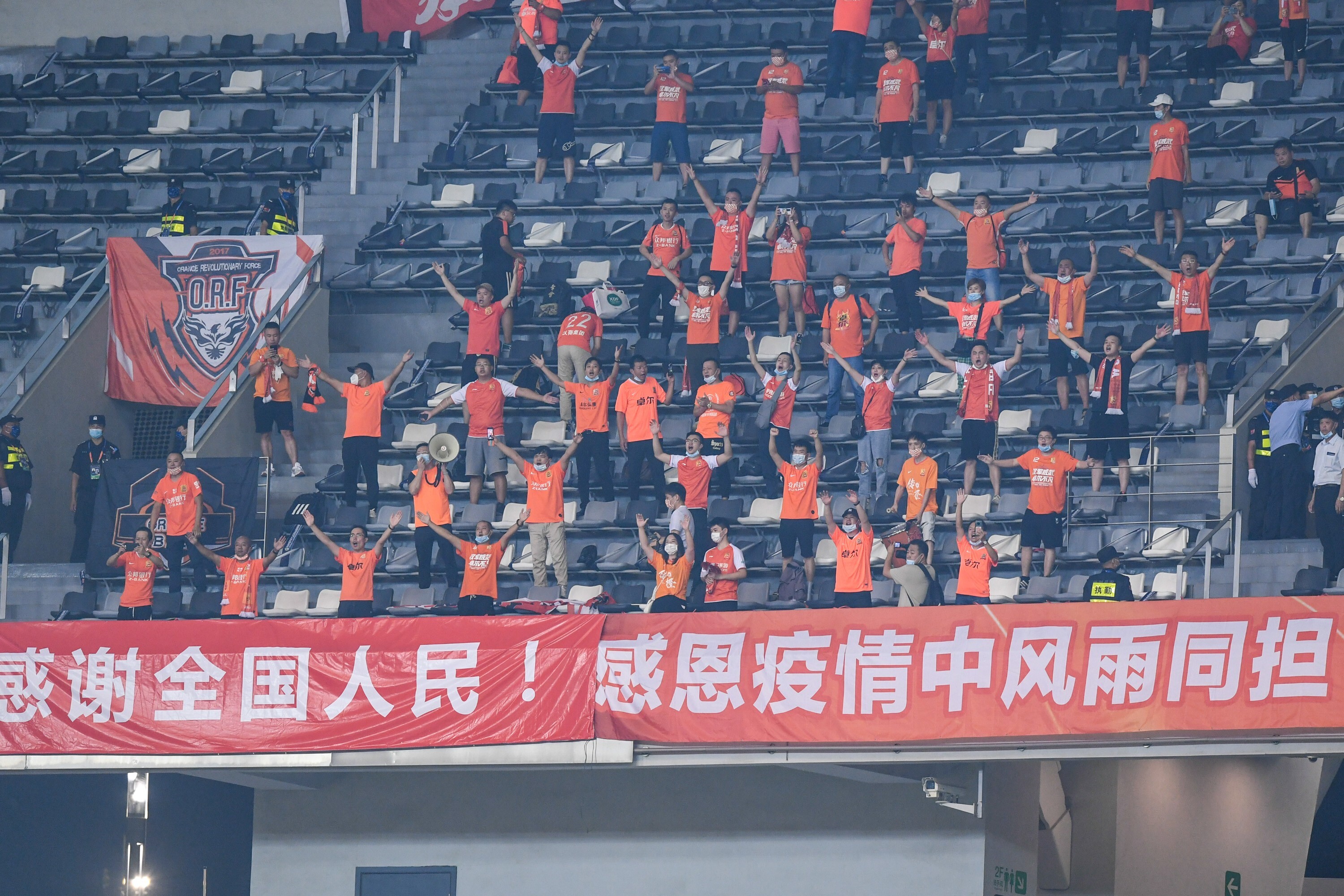 Wuhan Zall supporters cheer during a match against Beijing Guoan in the Chinese Super League in September. Photo: Xinhua