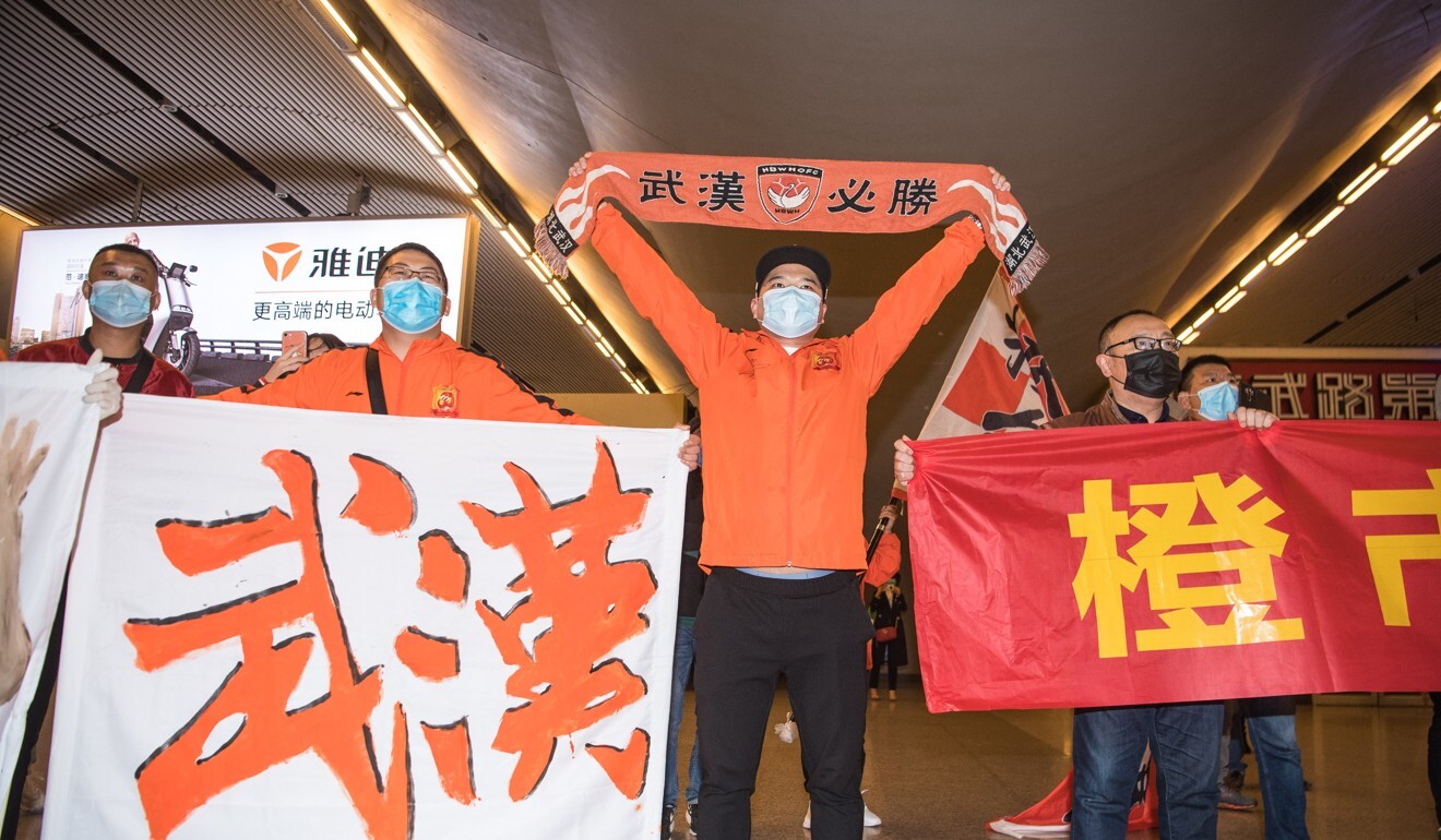 Wuhan Zall fans welcome the team after they arrive at Wuhan railway station in Hubei province in April. Photo: Xinhua