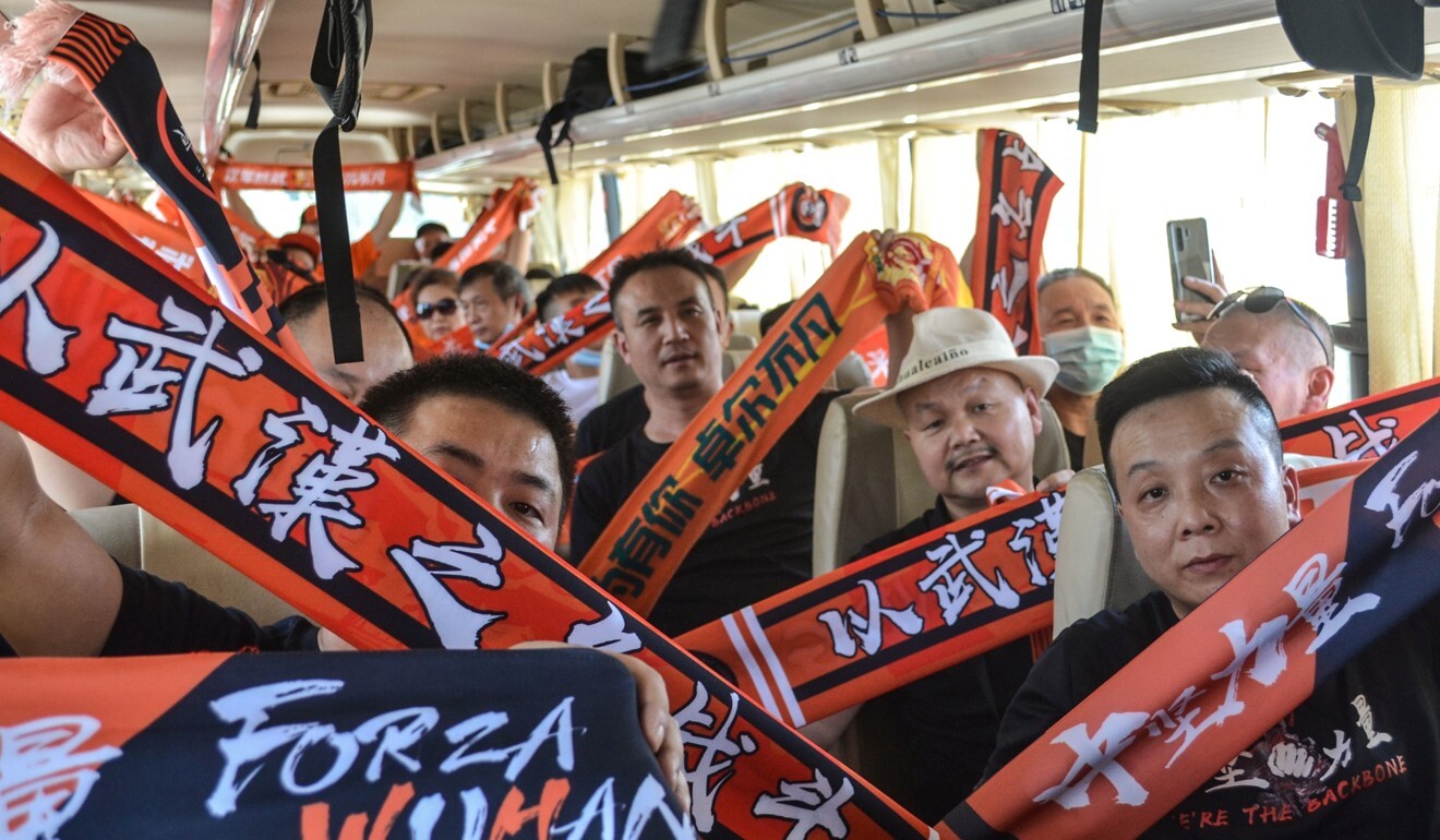 Fans of Wuhan Zall on a bus in Suzhou, in China’s eastern Jiangsu province ahead of a CSL game. Photo: AFP