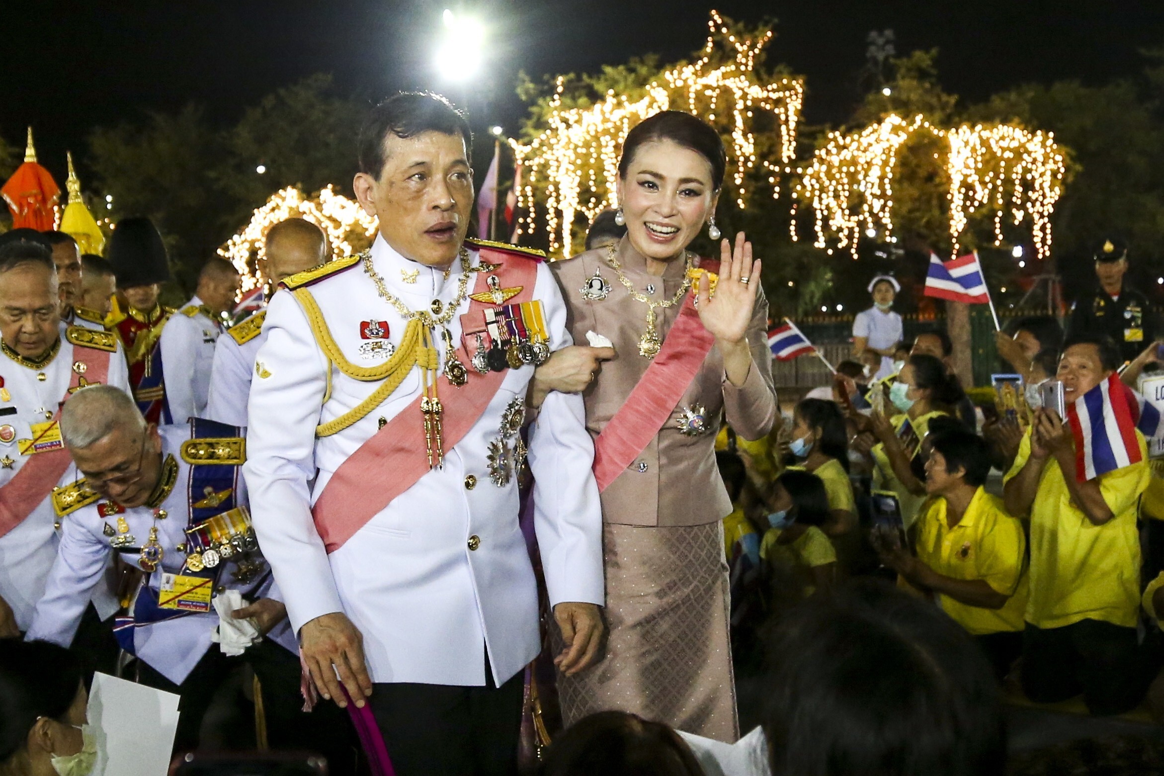 Thai King Maha Vajiralongkorn and Thai Queen Suthida greet supporters outside the Grand Palace in Bangkok. Photo: EPA