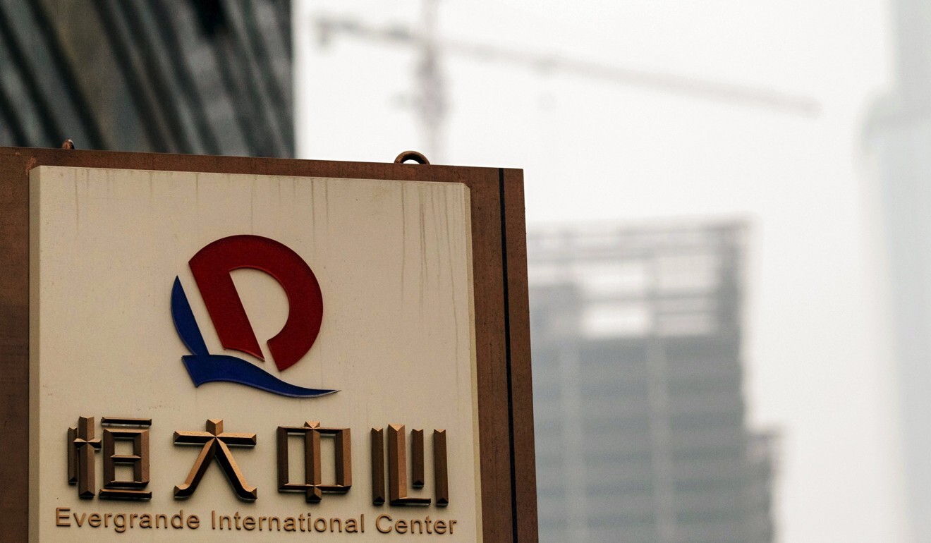 A logo of Evergrande Group is seen in front of a construction site in Guangzhou, Guangdong province, in this 2014 file photo. Photo: Reuters
