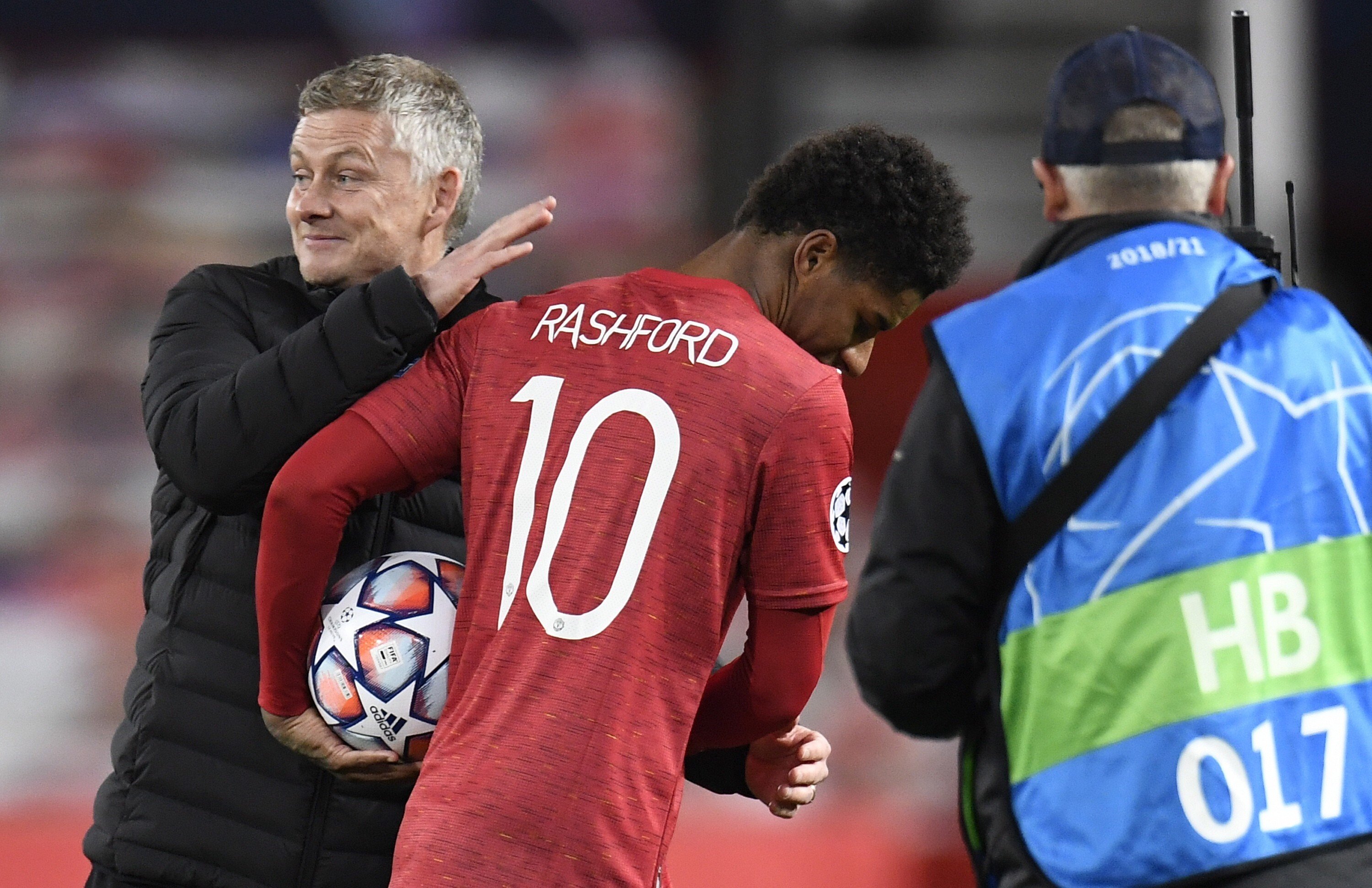 Marcus Rashford of Manchester United is congratulated by manager Ole Gunnar Solskjaer after their Uefa Champions League victory against RB Leipzig. Photo: EPA