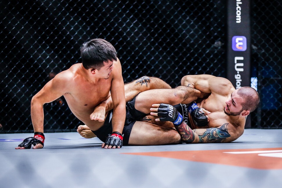 Iuri Lapicus looks for as leg lock on Christian Lee.