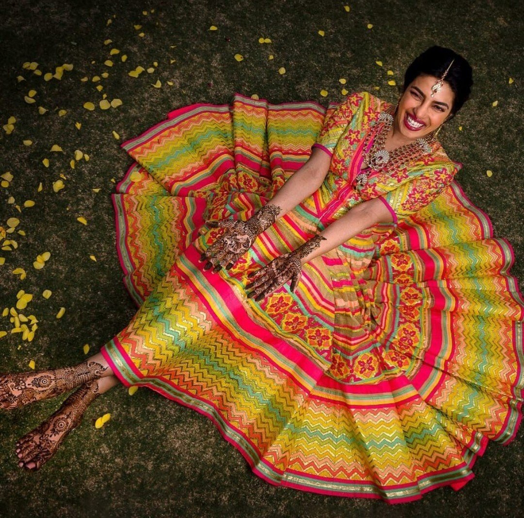 Actress Priyanka Chopra Jonas in designer Abu Jani Sandeep Khosla, the label behind one of the outfits worn by Isha Ambani at her wedding.