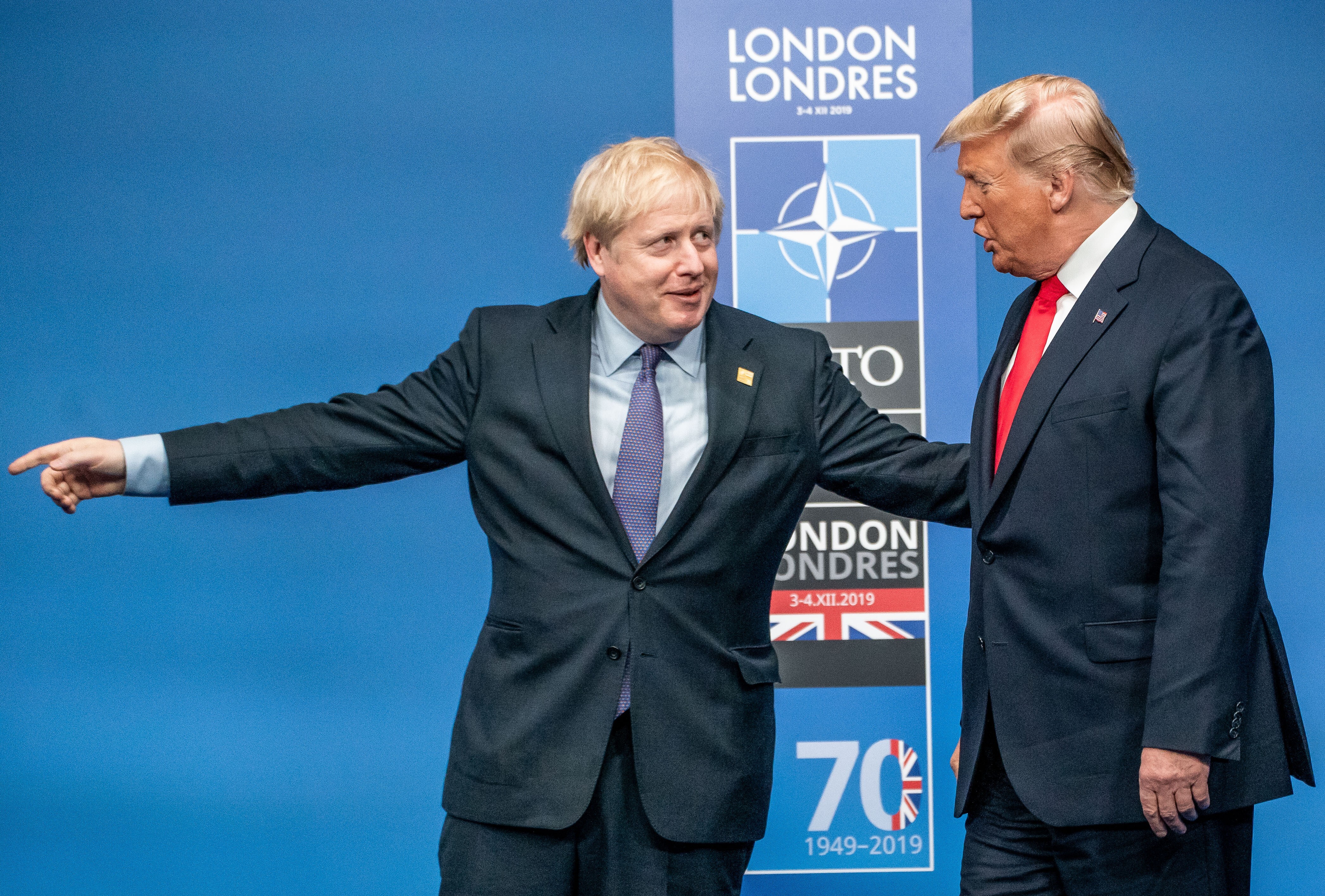 British Prime Minister Boris Johnson (left) welcomes US President Donald Trump before the start of a round table meeting during the annual Nato Leaders Summit in Watford, England, on December 4, 2019. Photo: dpa