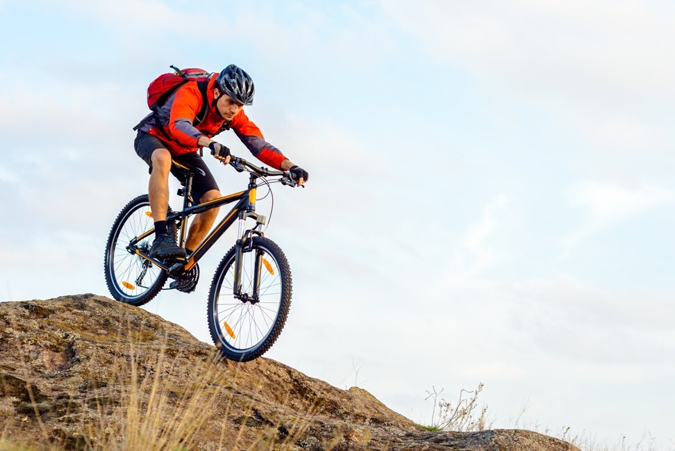 The correct posture and position make all the difference when mountain biking. Photo: Shutterstock