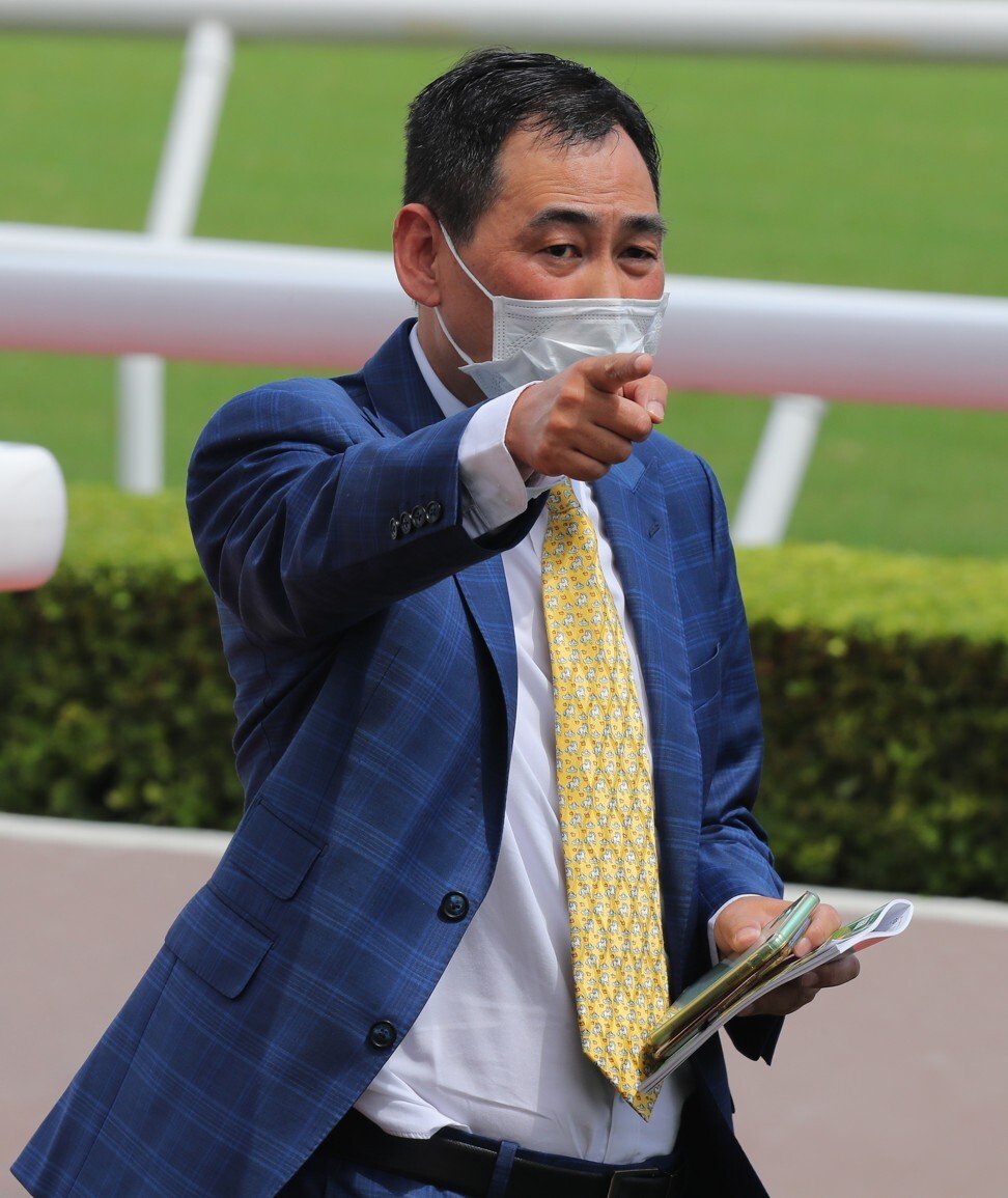 Trainer Michael Chang celebrates a winner.