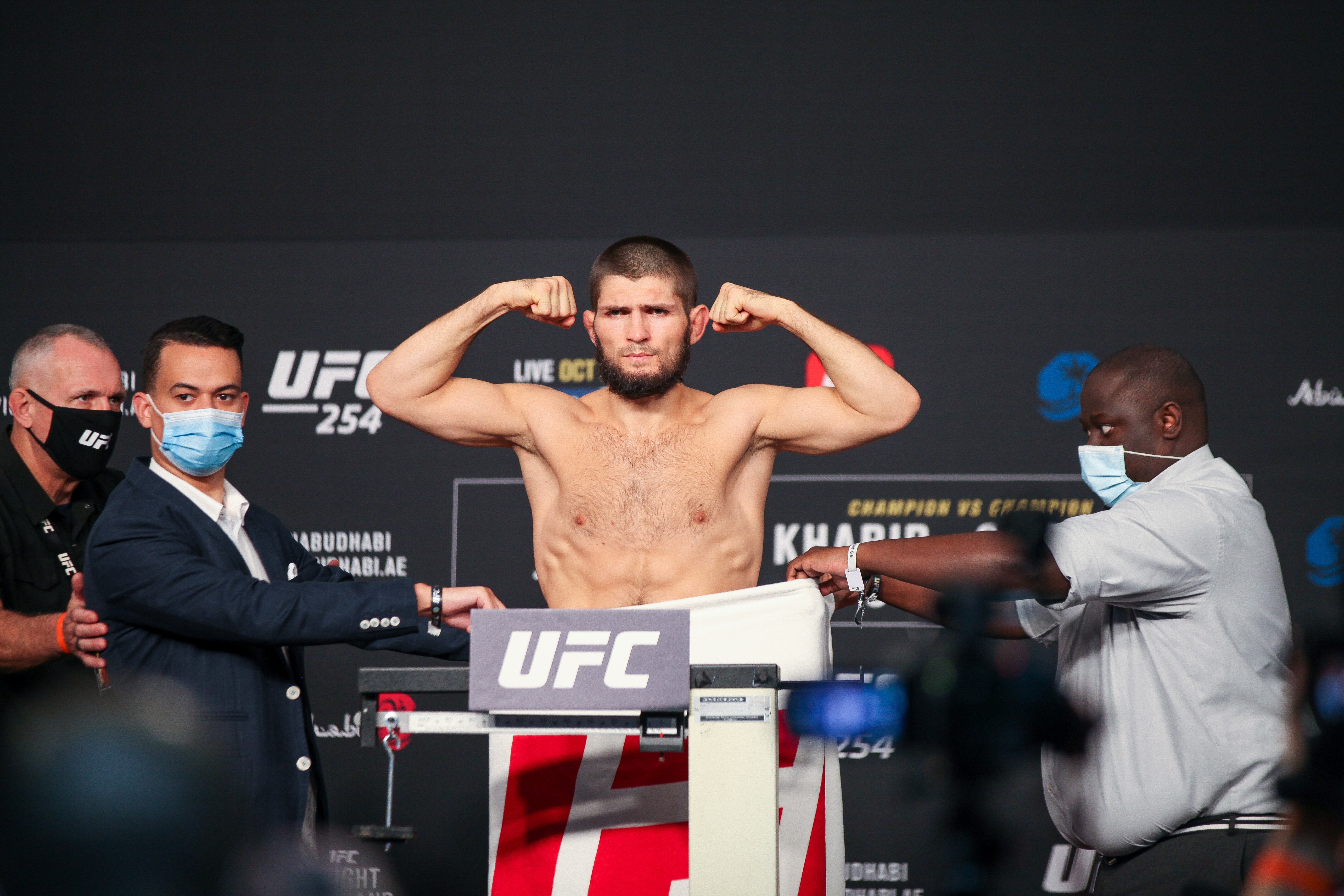 Khabib Nurmagomedov poses on the scale after officially making weight for UFC 254. Photo: Amy Kaplan
