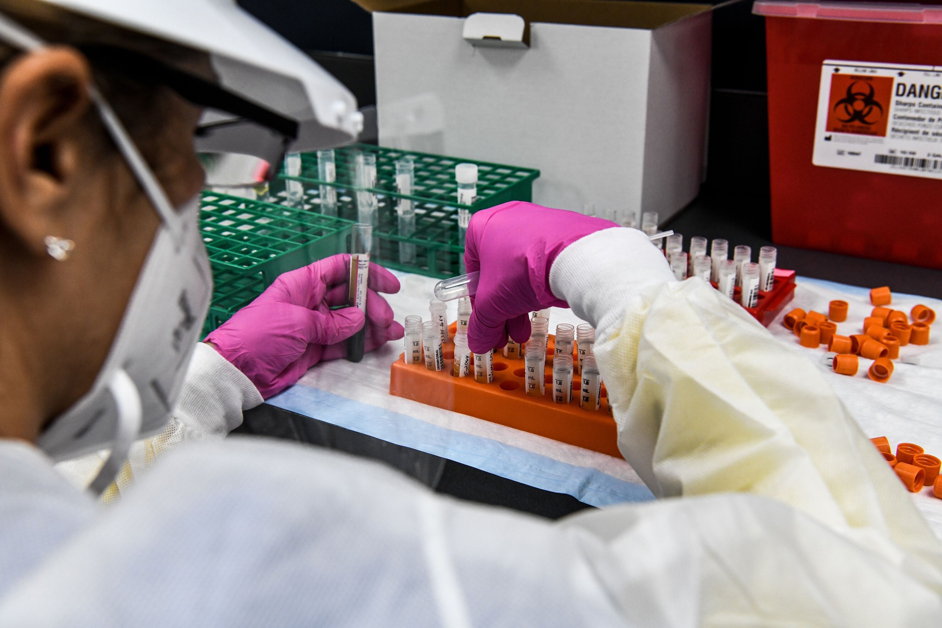 A technician sorts blood samples inside a lab for a Covid-19 vaccine study at the Research Centers of America in Hollywood, Florida, on August 13. Photo: AFP/Getty Images/TNS