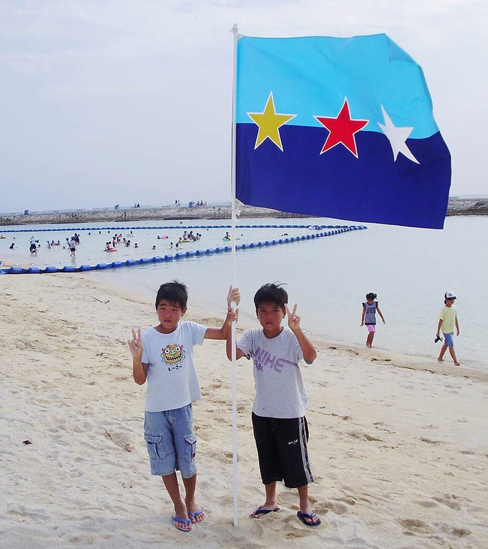 The flag of the Ryukyu Independence Party – which the party hopes will become the flag of a new Ryukyu nation – incorporates the colours of the ocean and the sky, with the red star representing pride and passion. Photo: Ryukyu Independence Party