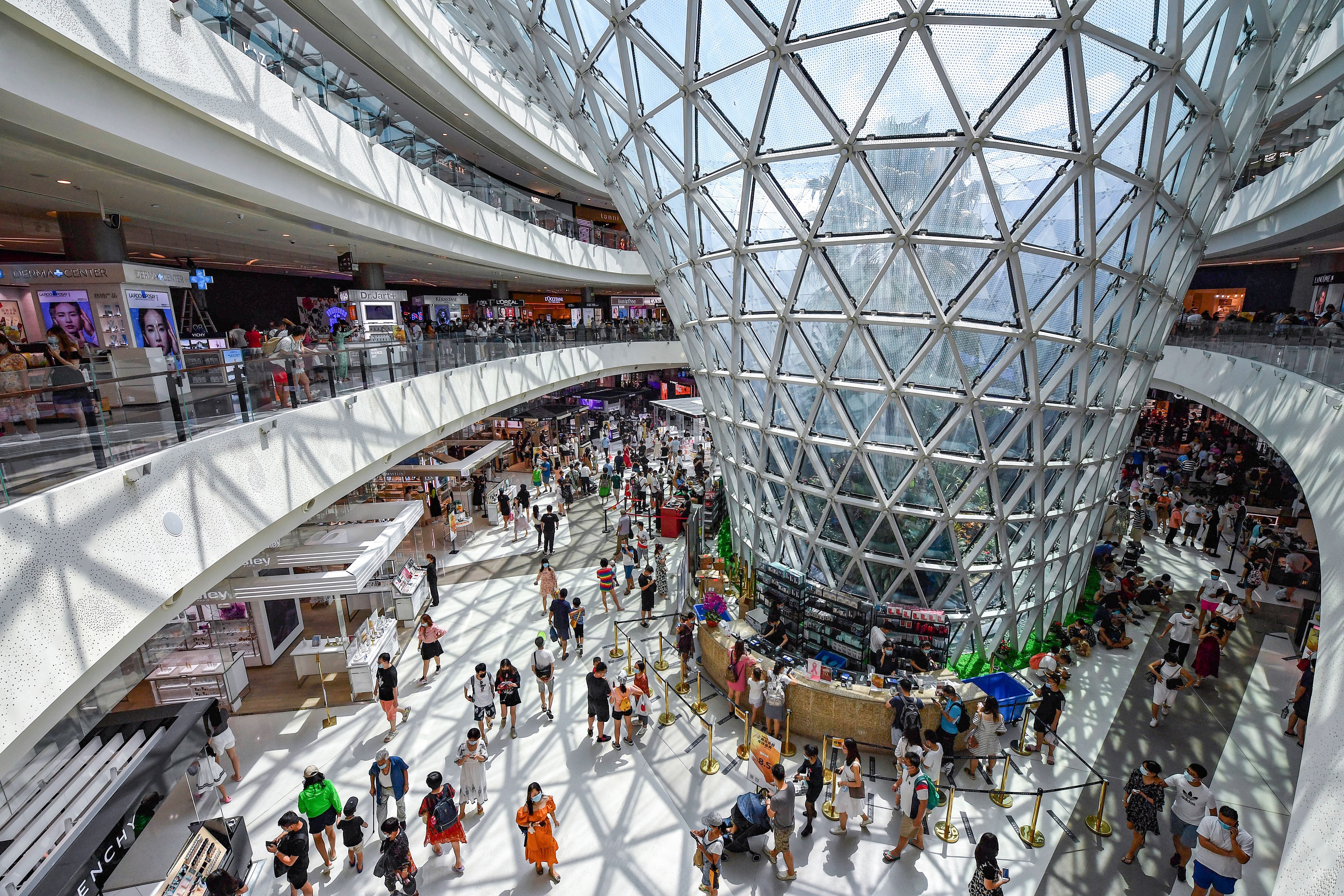 Shoppers walk round a duty-free mall in Sanya, on Hainan island. China is pinning its hopes for growth on domestic consumption, which should being new opportunities for Hong Kong companies providing goods and services. Photo: Xinhua