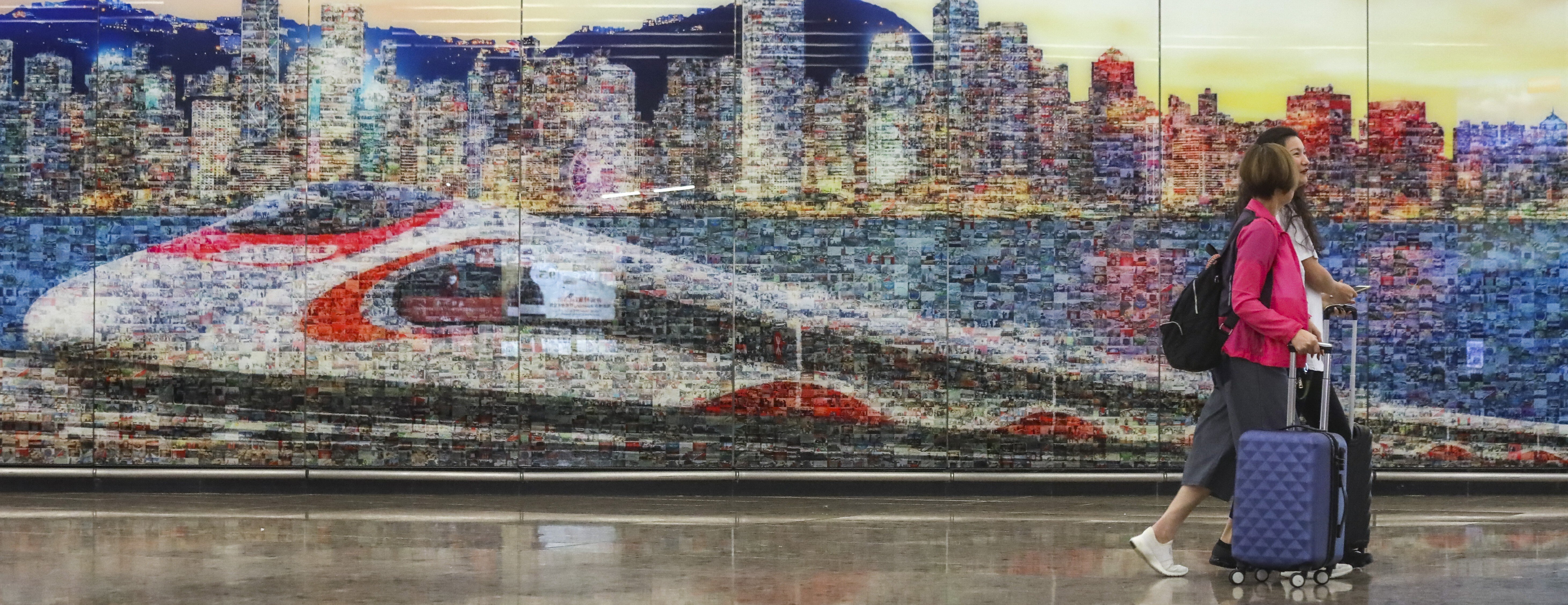 A station wall design showing a high-speed rail link train. Photo: K. Y. Cheng