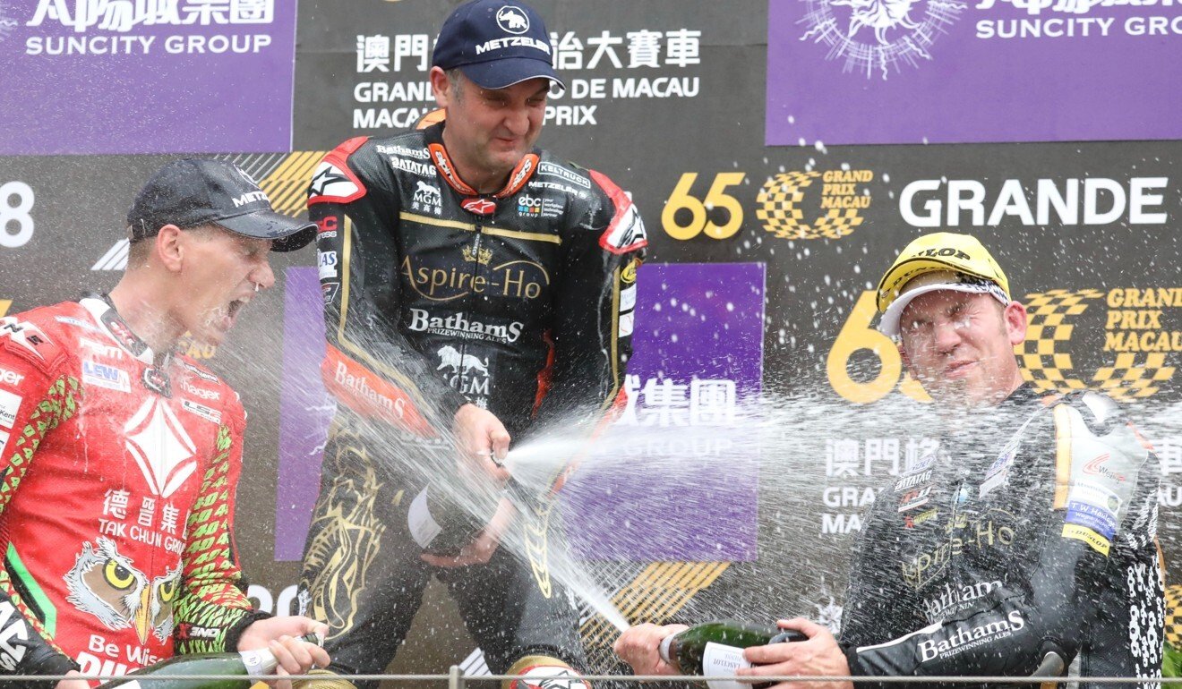 Martin Jessopp (left), Michael Rutter (top) and Peter Hickman spray champagne after the 2019 Macau Motorcycle Grand Prix. Photo: K.Y. Cheng
