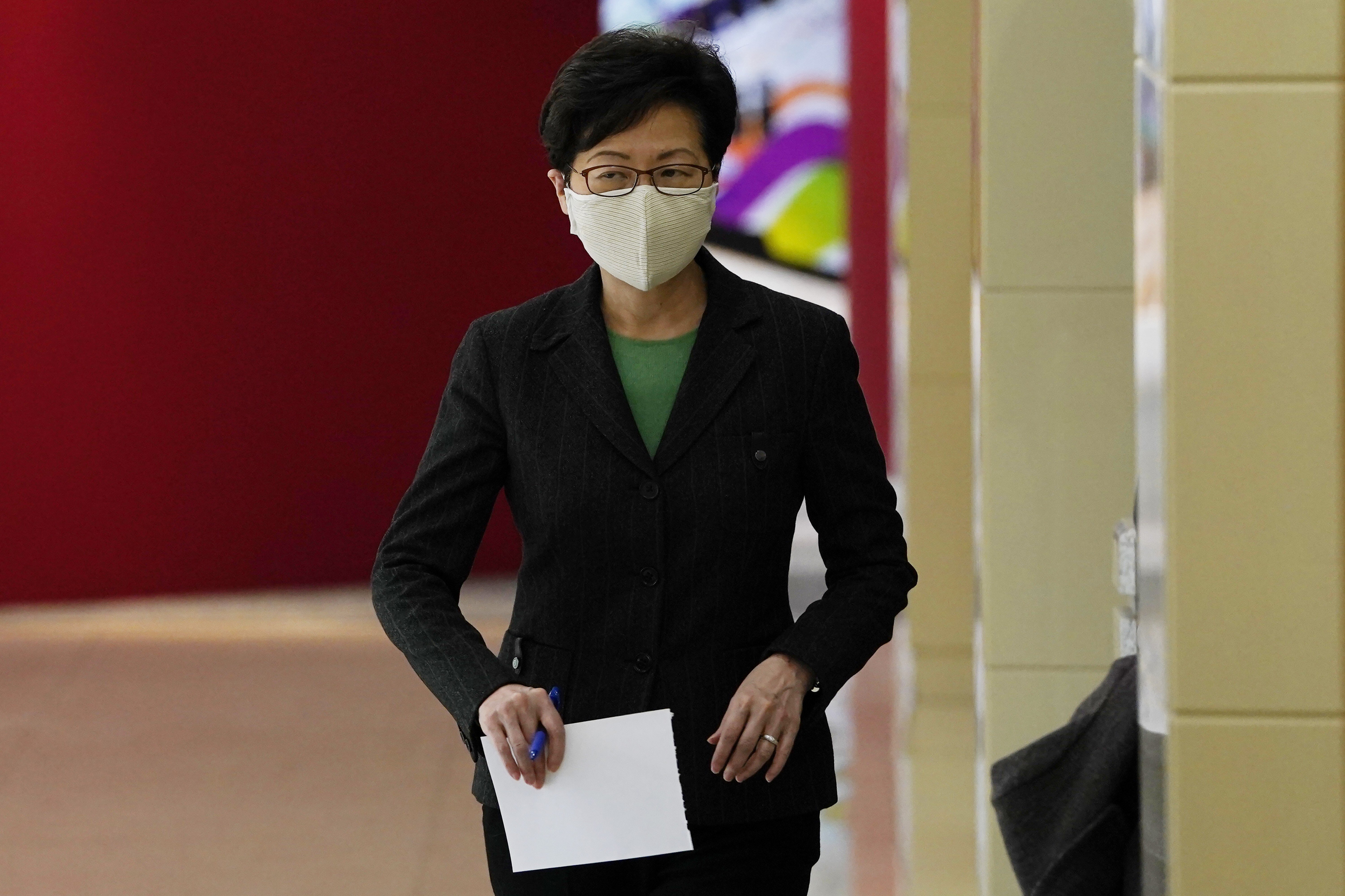 Hong Kong Chief Executive Carrie Lam arrives for a press conference in Beijing on Friday. Photo: AP