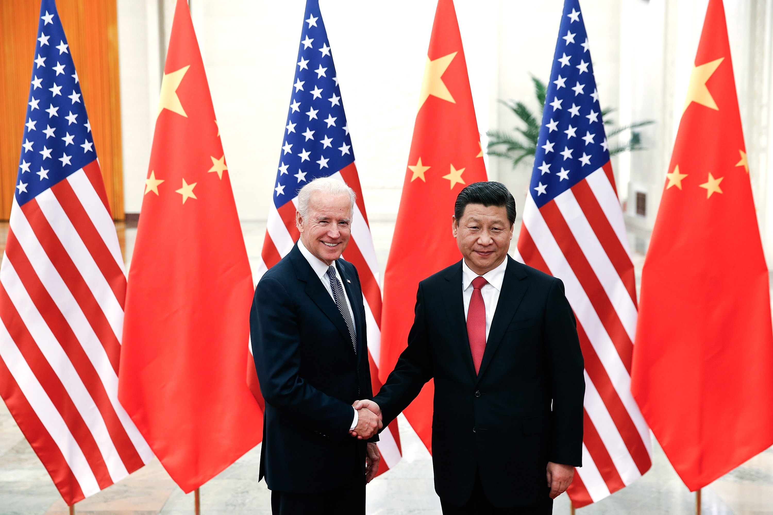 Joe Biden, then US vice-president, shakes hands with Chinese President Xi Jinping at the Great Hall of the People in Beijing on December 4, 2013. Photo: Getty Images/TNS