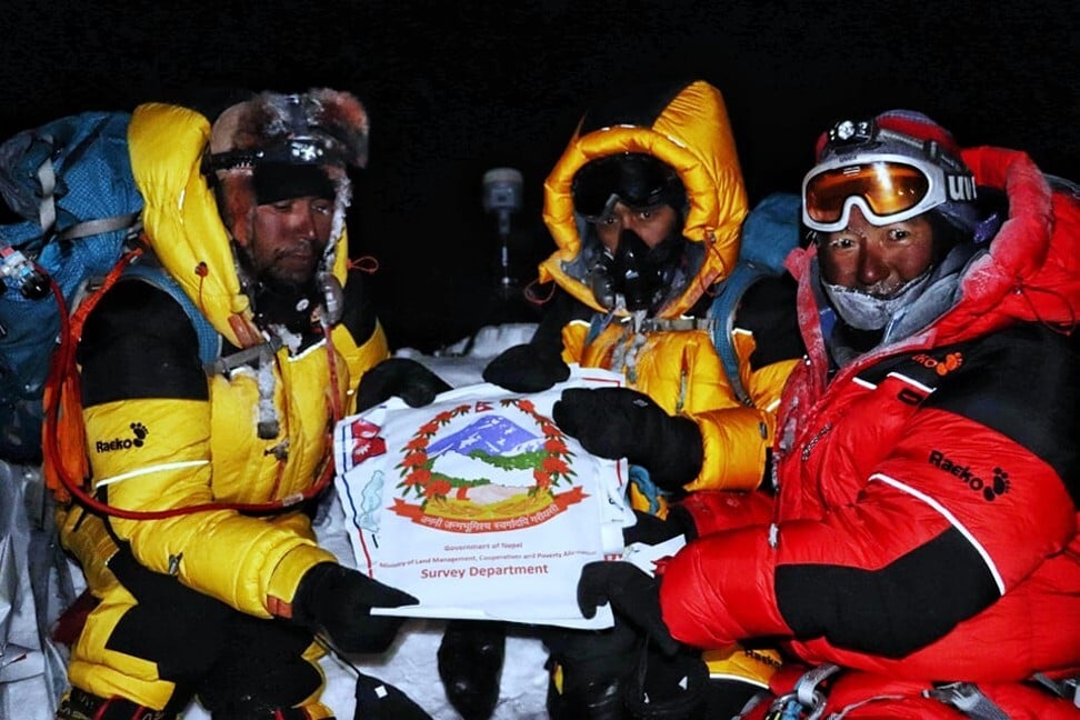 Khim Lal Gautam (left) and his teammates at the top of Mount Everest.