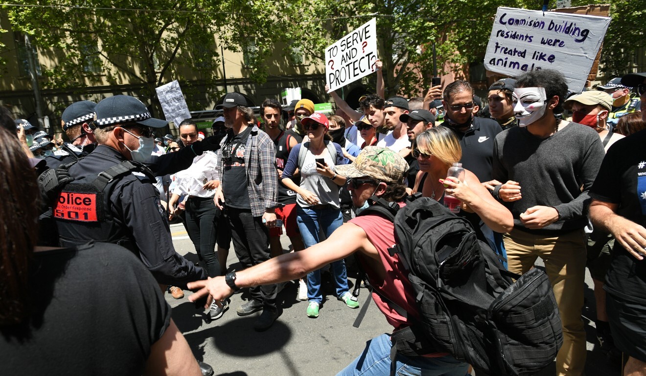 Scuffles between protesters and police during an anti-lockdown rally in Melbourne. Photo: EPA