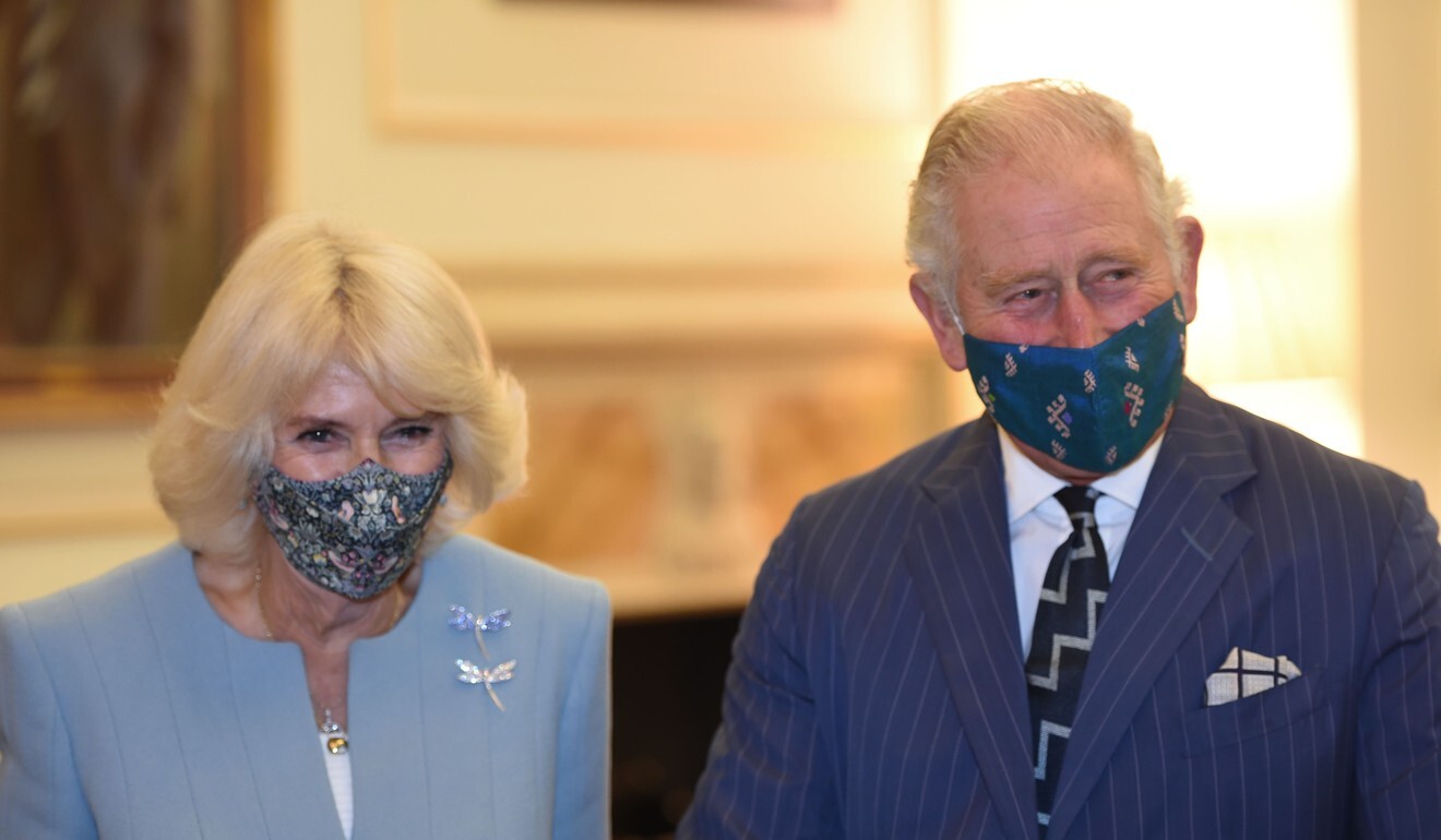 Prince Charles, Prince of Wales and Camilla, Duchess of Cornwall are masked up for a visit to the Bank of England in October. Photo: Eddie Mulholland/AFP