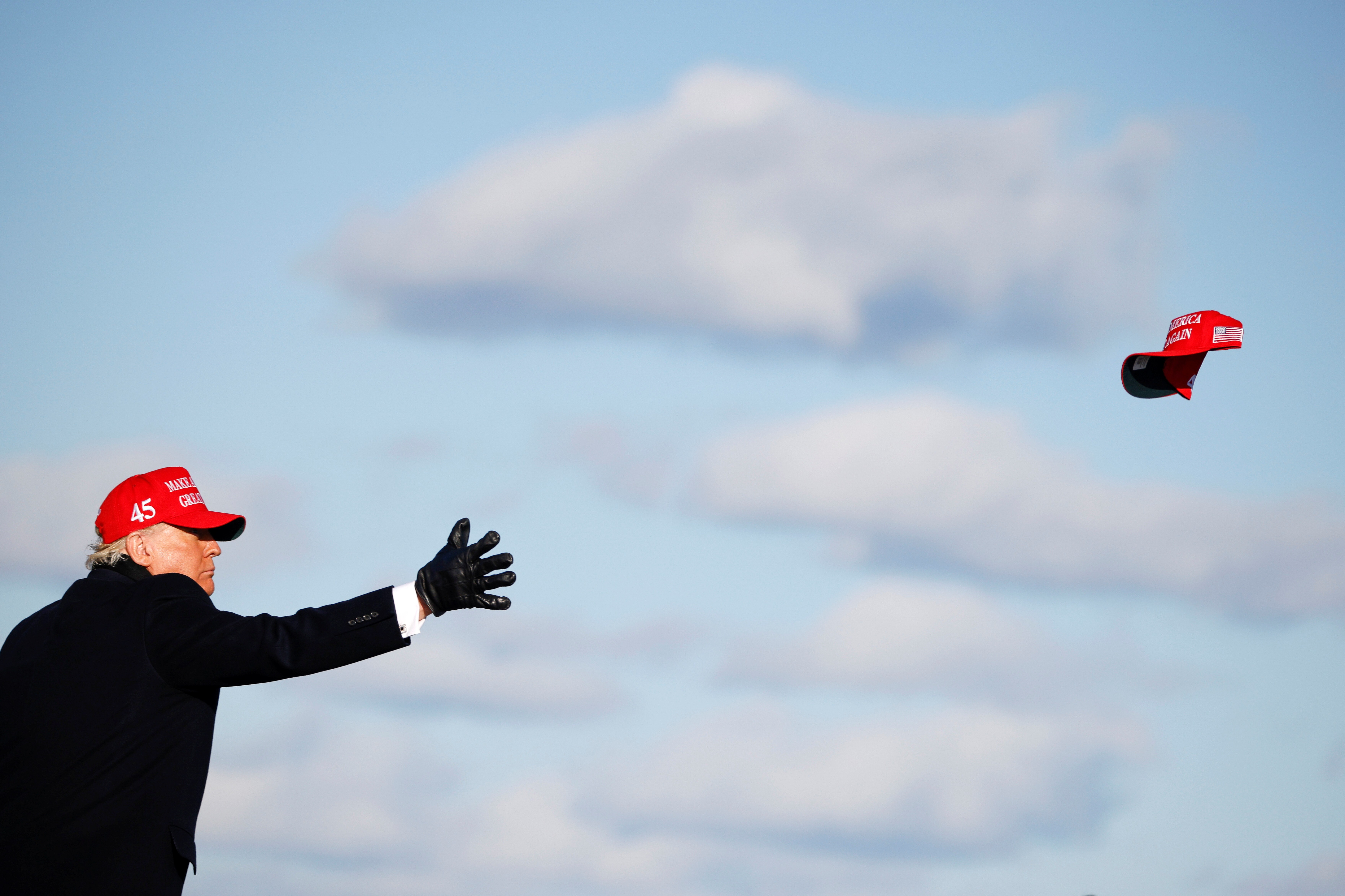 US President Donald Trump tosses a “Make America Great Again” cap during a campaign rally at Wilkes-Barre Scranton International Airport in Avoca, Pennsylvania, on November 2. Would-be autocrats in liberal democracies, like Trump, cannot disseminate nationalist propaganda nearly as efficiently or uniformly as Beijing. Photo: Reuters