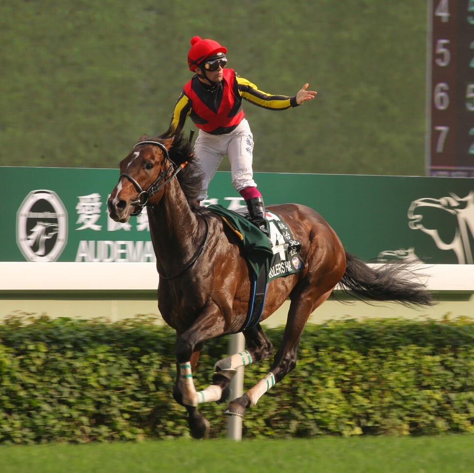 Umberto Rispoli wins the 2012 QE II Cup aboard Rulership.