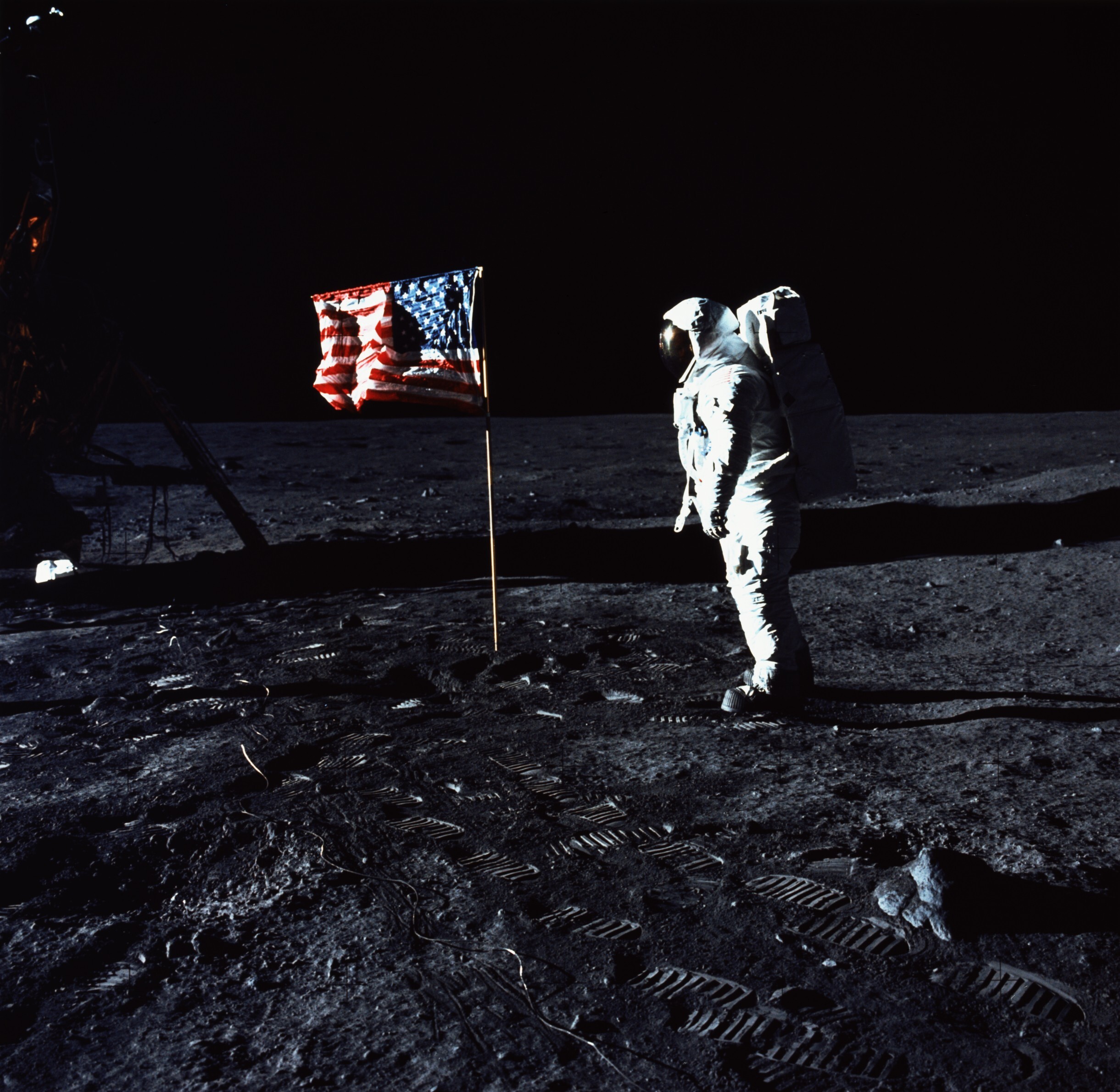 Astronaut Buzz Aldrin stands by the American flag on the surface of the moon on July 20, 1969. Photo: Getty Images