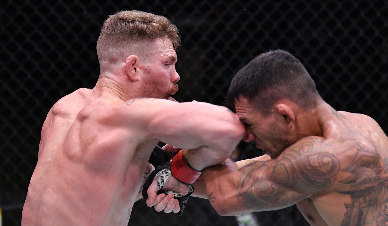 Paul Felder elbows Rafael Dos Anjos in their lightweight fight at UFC Vegas 14.