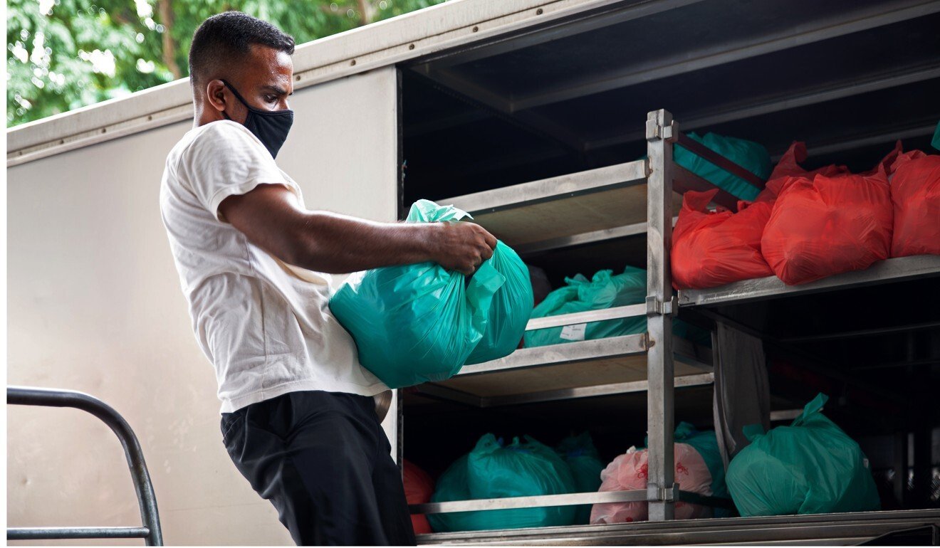 Meals are loaded onto delivery vehicles to distribute to dorms. Photo: Olyvia Lim
