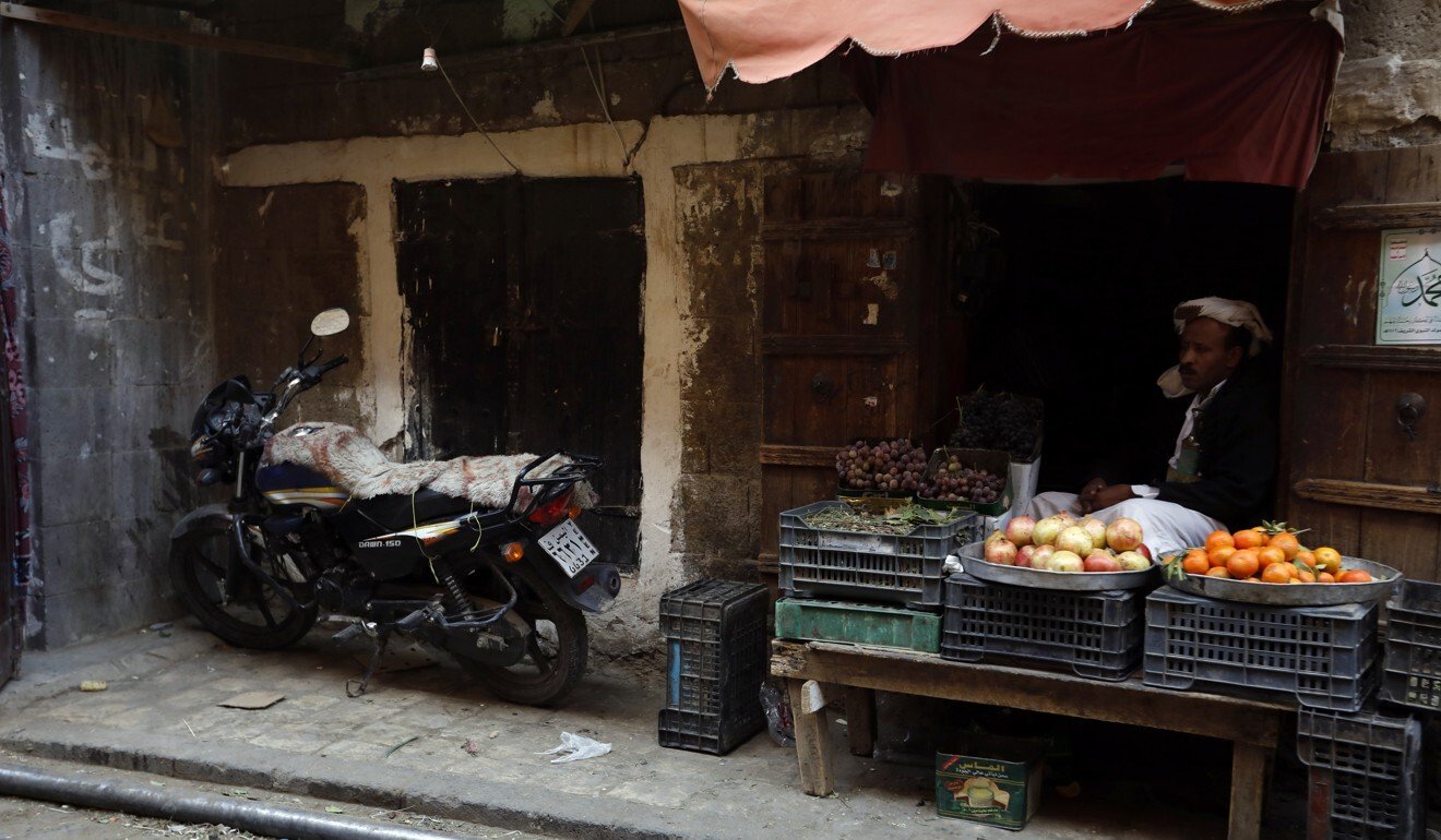A Yemeni vendor waits for customers at a market in Sana'a, Yemen. Photo: EPA-EFE