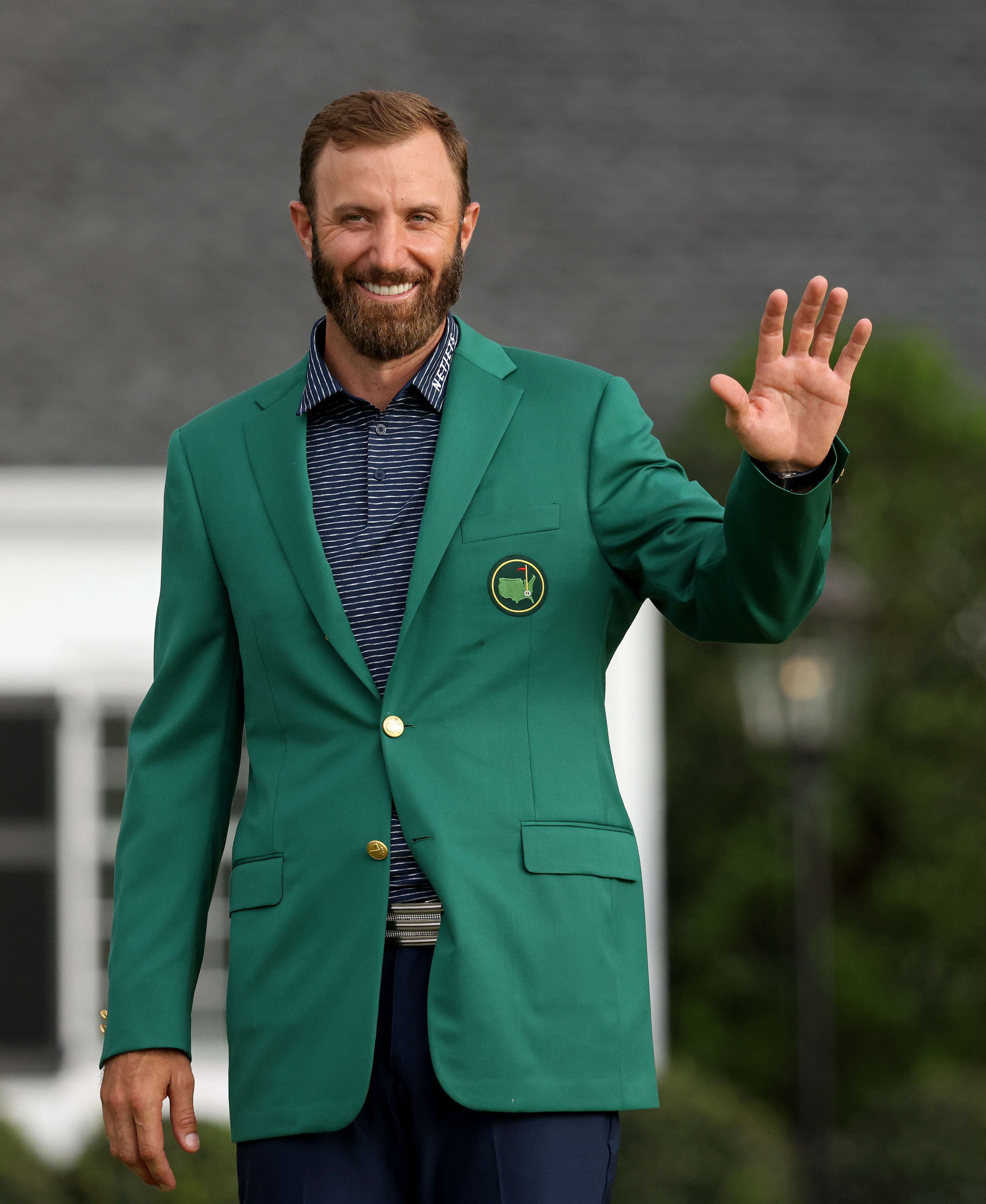 Dustin Johnson of the United States waves during the Green Jacket Ceremony after winning the Masters at Augusta National Golf Club in Georgia, US on Sunday. Photo: Getty Images / AFP