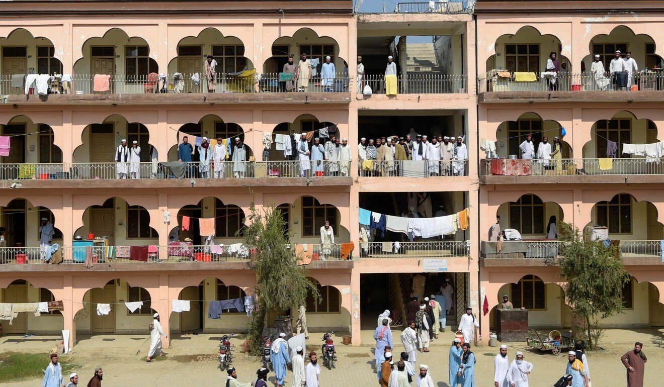 Islamic seminary students gather in the premises of the hostel at the Darul Uloom Haqqania seminary. Photo: AFP