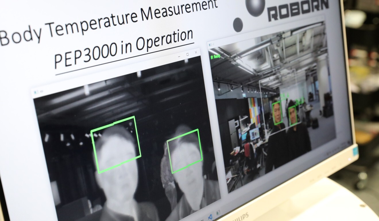 A display on Roborn Technology’s 5G-enabled mobile PEP3000 robot shows body temperature scans of people’s foreheads, which can detect signs of a fever. Photo: SCMP/K.Y. Cheng