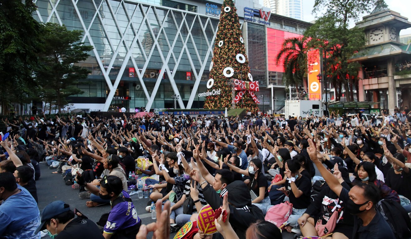 Pro-democracy demonstrators show the three-finger salute during a rally in Bangkok on November 18. Photo: Reuters